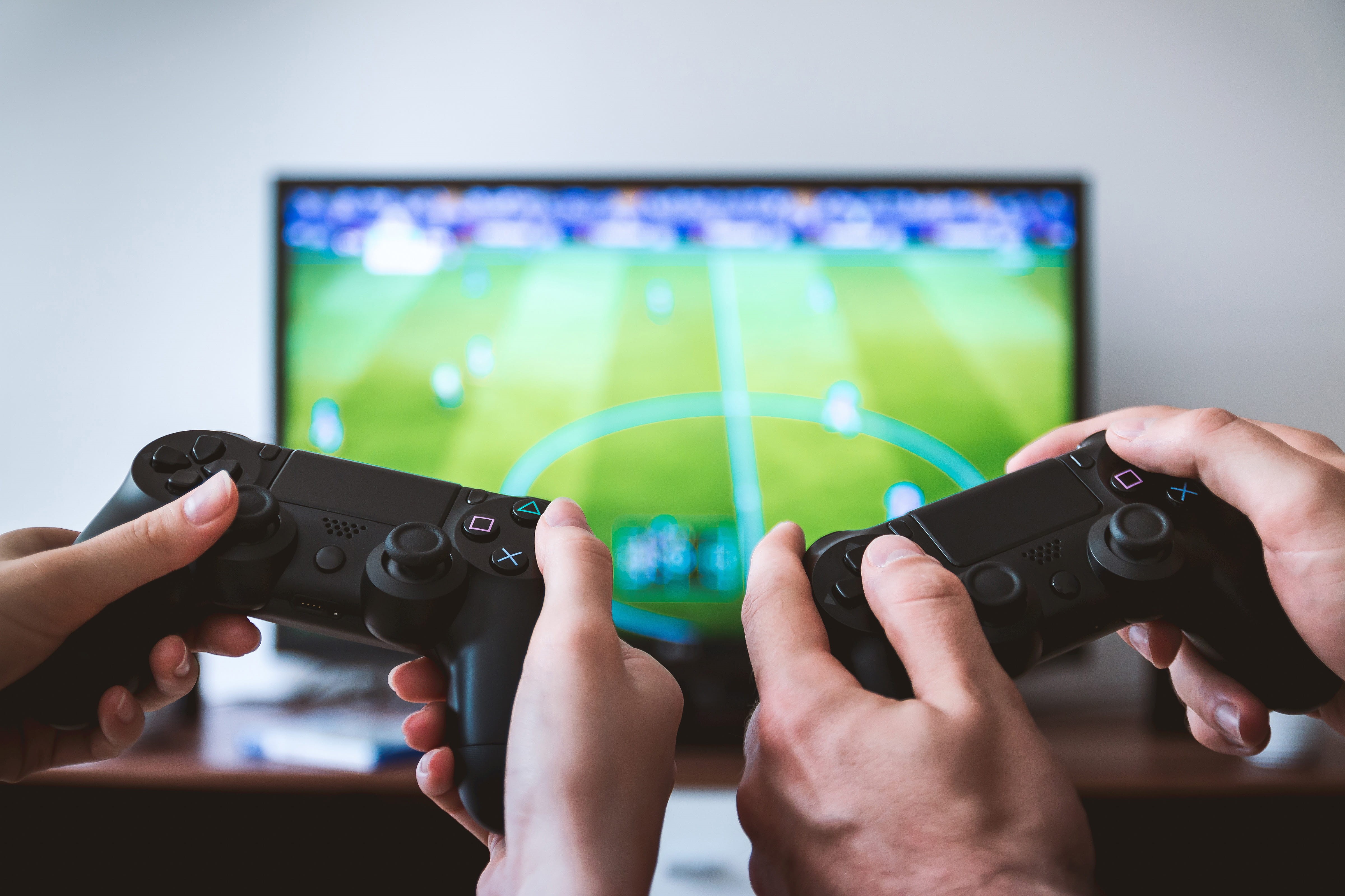 hands, focus on foreground, television set, videogame, human limb, blur, holding, watching, playing, ps, wireless technology, close-up, watching tv, hobby, HD Wallpaper
