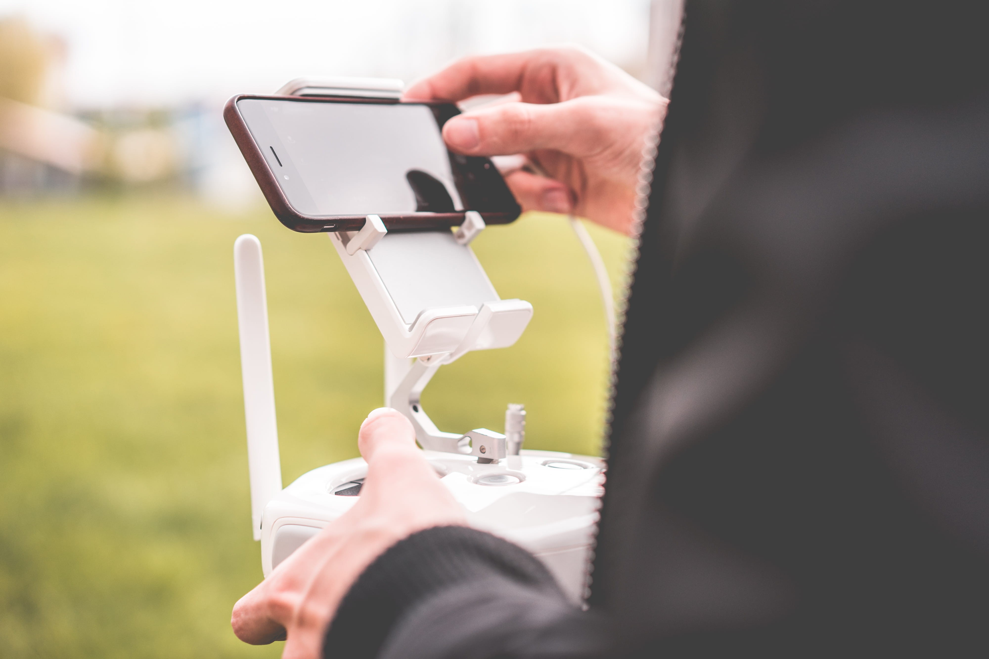 midsection, no drone zone, safety, leisure activity, FPV, business, male, mobile Phone, real people, people, outdoors, human Hand, transmitter, flying, HD Wallpaper