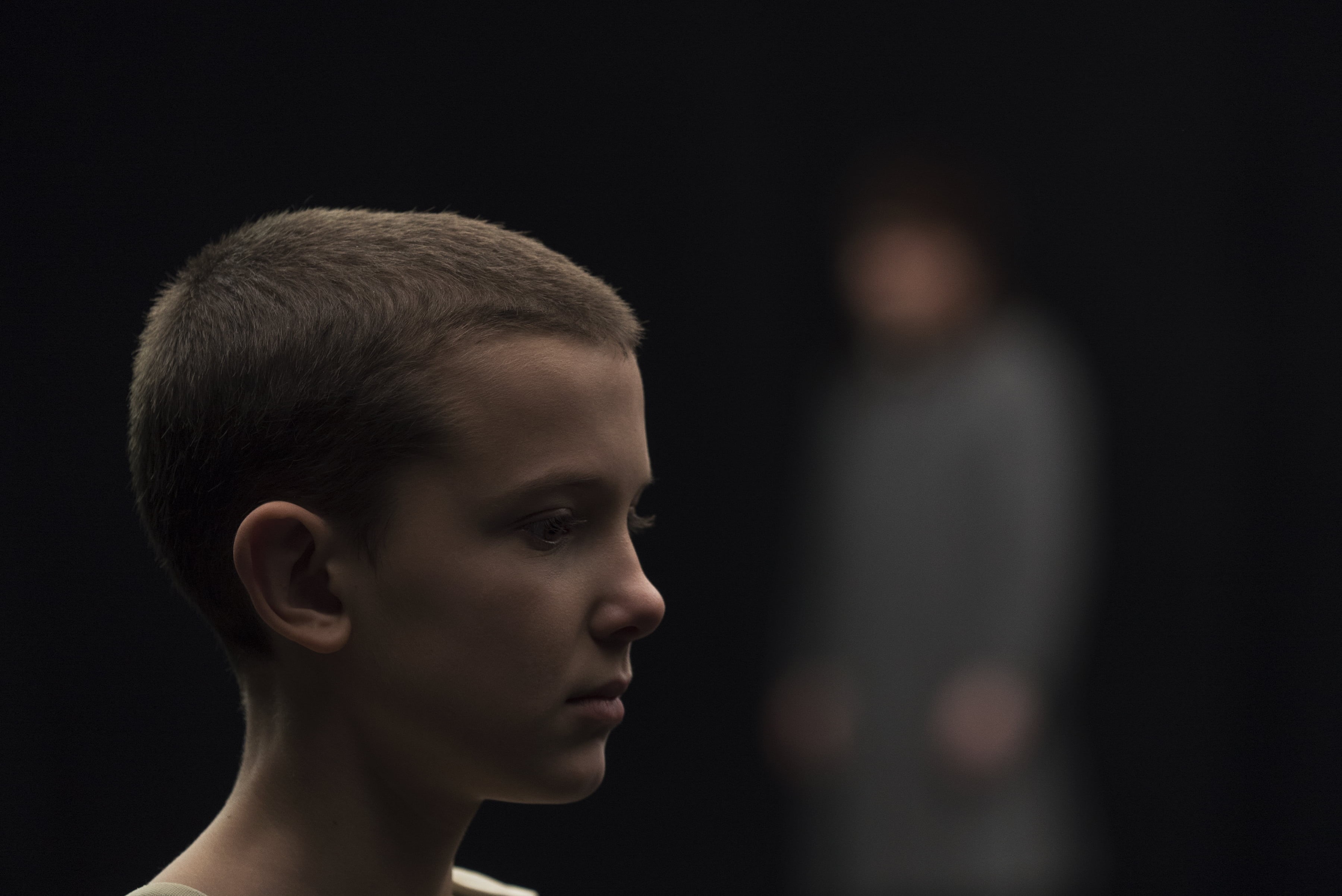 men, 2K, eleven stranger things, body part, headshot, tv shows, one person, side view, human face, indoors, contemplation, black background, portrait, HD Wallpaper