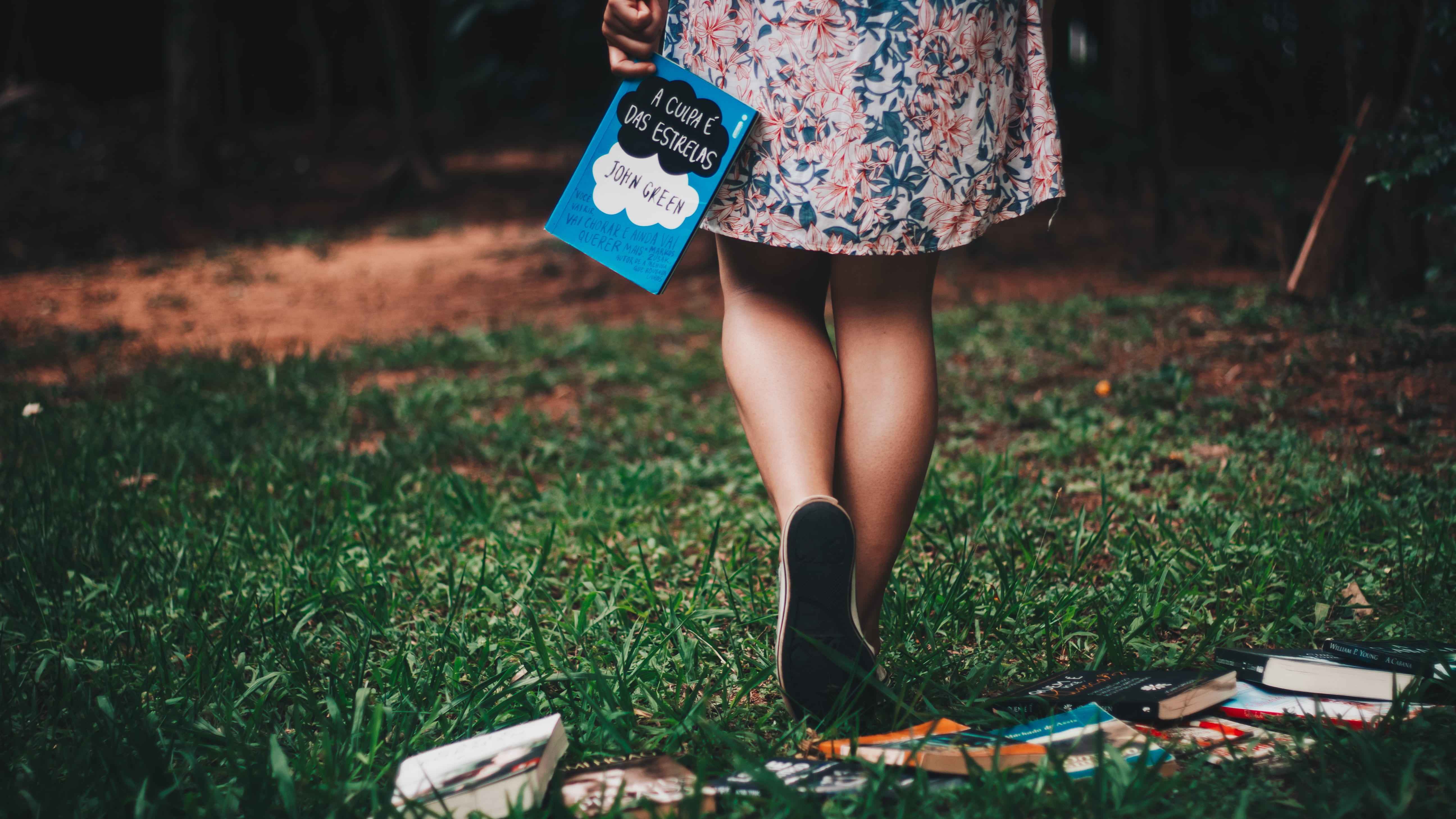 grass, body part, woman, book, dress, real people, human leg, stars, day, 5K, adult, walker, lifestyles, fashion, leisure activity, green, holding, floral pattern, HD Wallpaper