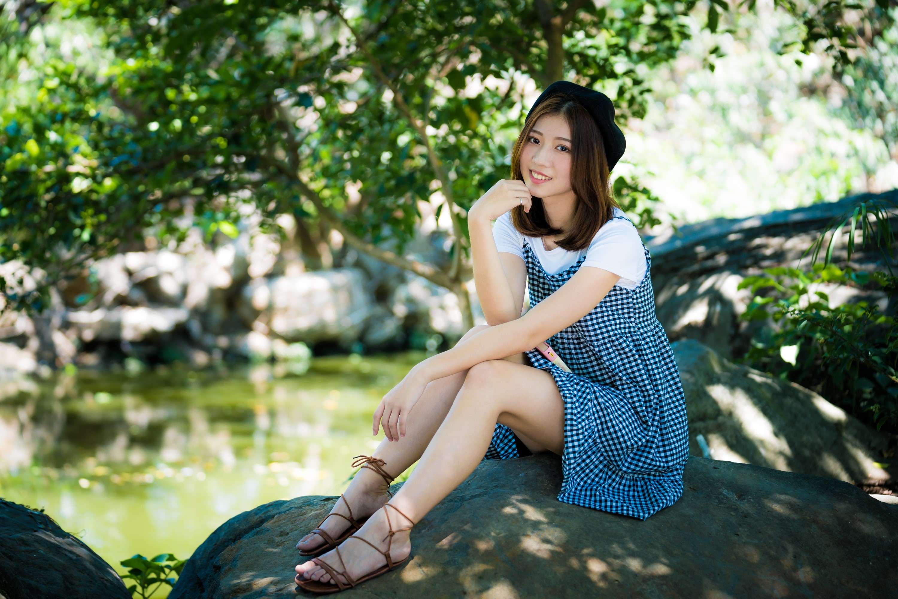 berets, women outdoors, model, sandals, rocks, dress, depth of field, women, looking at viewer, 2K, smiling, Asian, sitting, water, brunette, HD Wallpaper