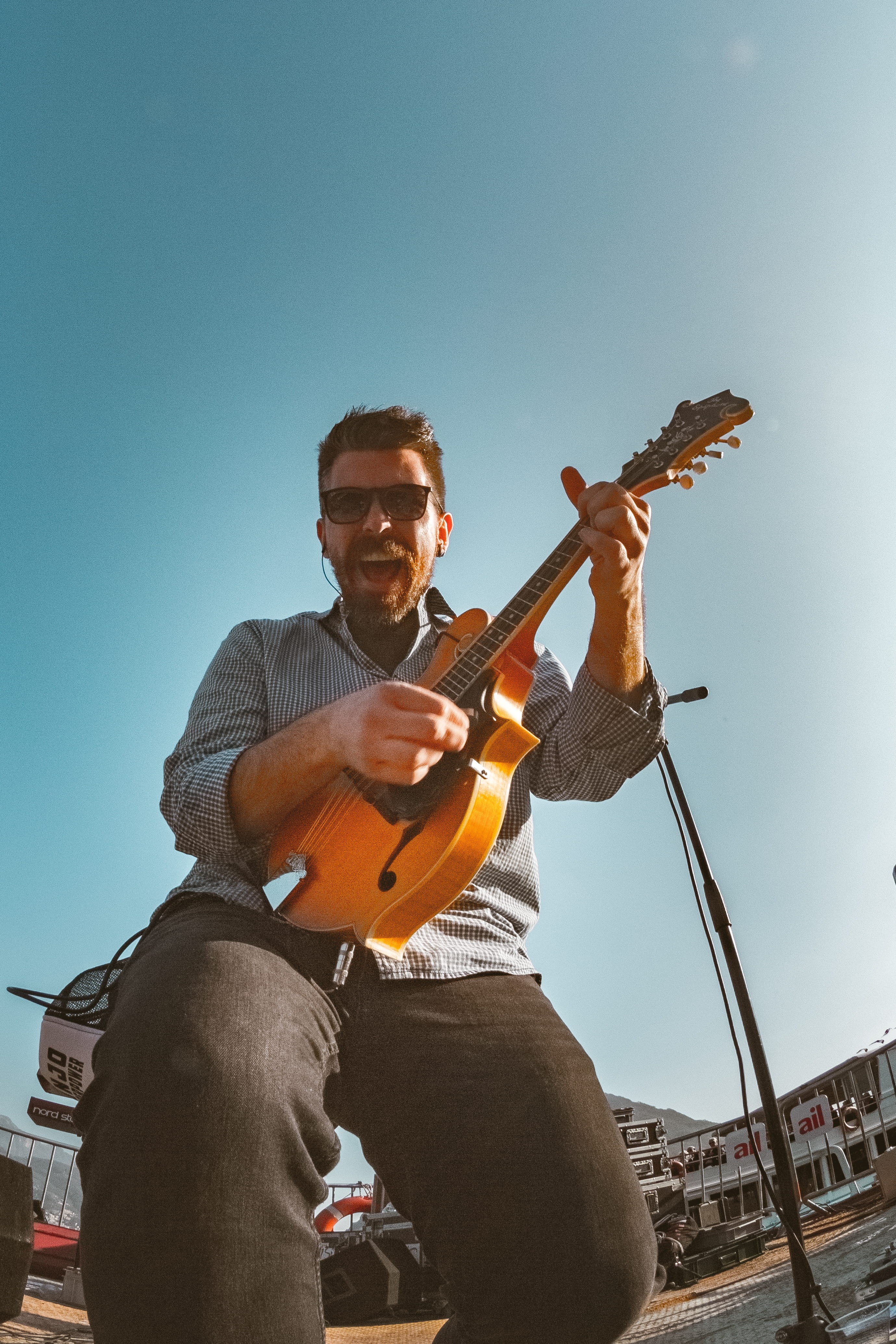hands, 4K, background, energy, fun, sunglasses, jazz, event, play, sitting, group, male, microphone, band, sky, playing, concert, recreation, stage, plucking an instrument, Phone HD Wallpaper