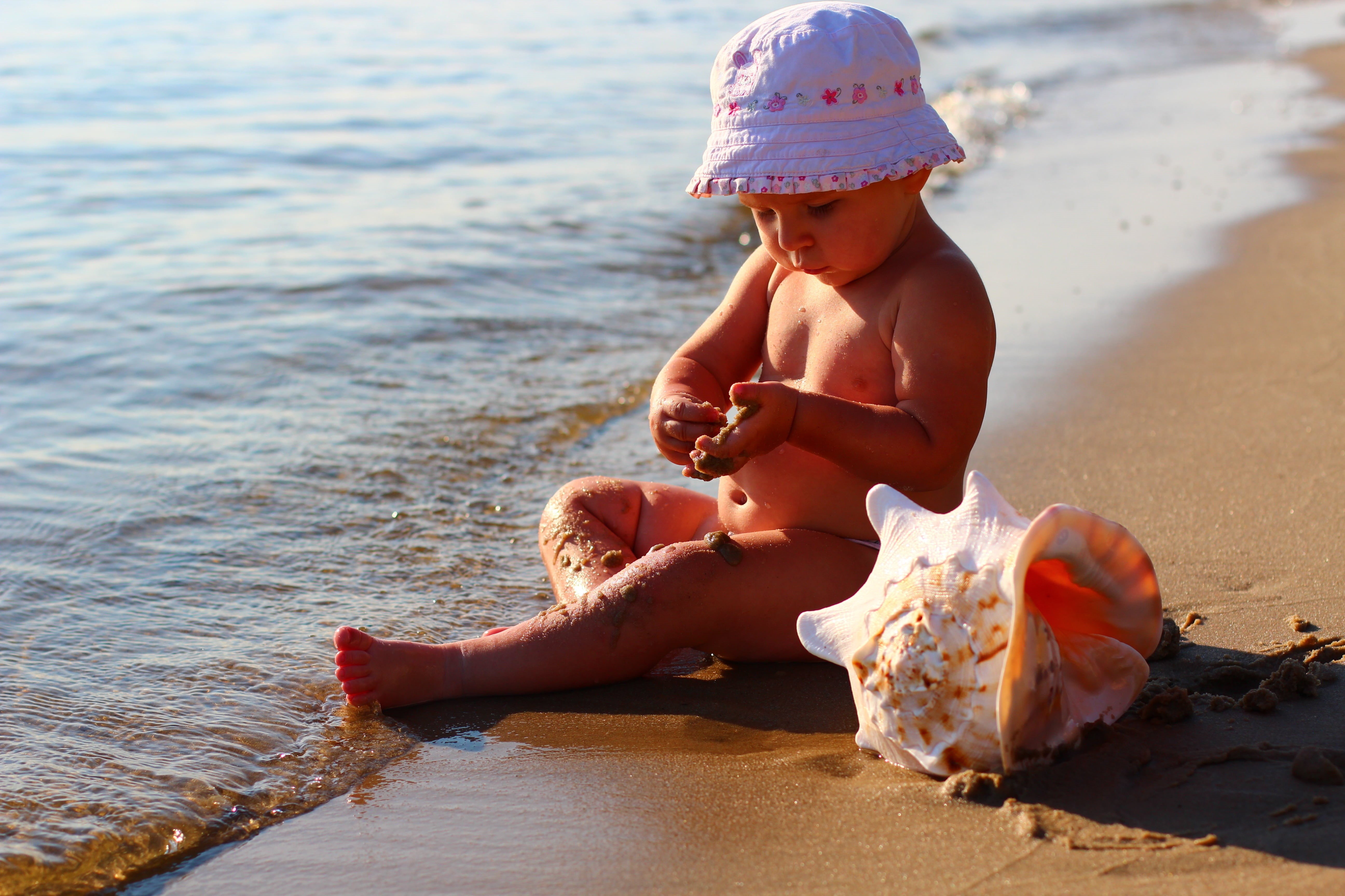 sand, water, small, shell, wearing, beach, happiness, cap, cute, females, caucasian Ethnicity, playing, happy, hat, land, childhood, young, beside, full length, HD Wallpaper