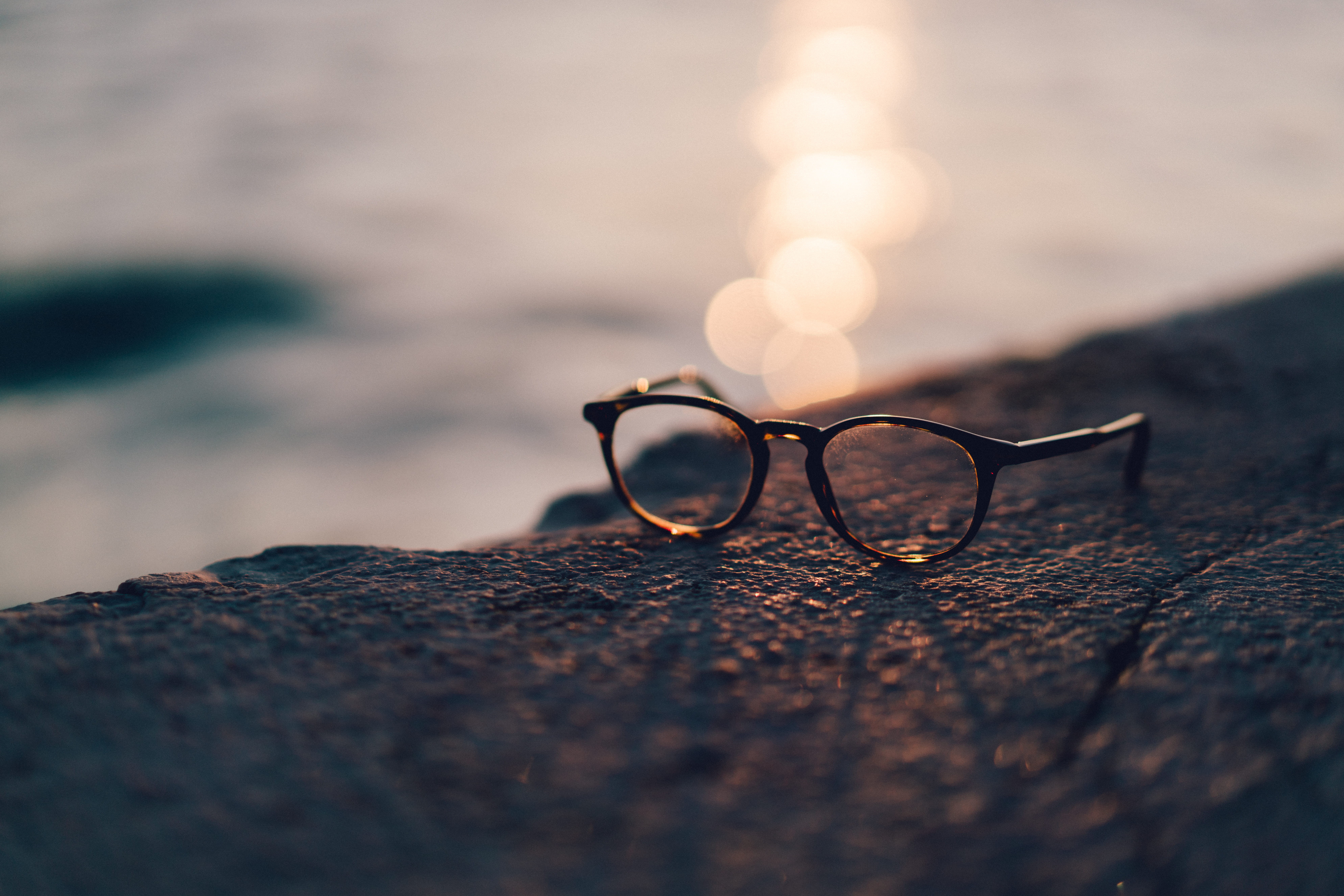 sunglasses, rock - object, 8K, black, personal accessory, two objects, close-up, close, wood - material, selective focus, absence, rock, water, bokeh, HD Wallpaper
