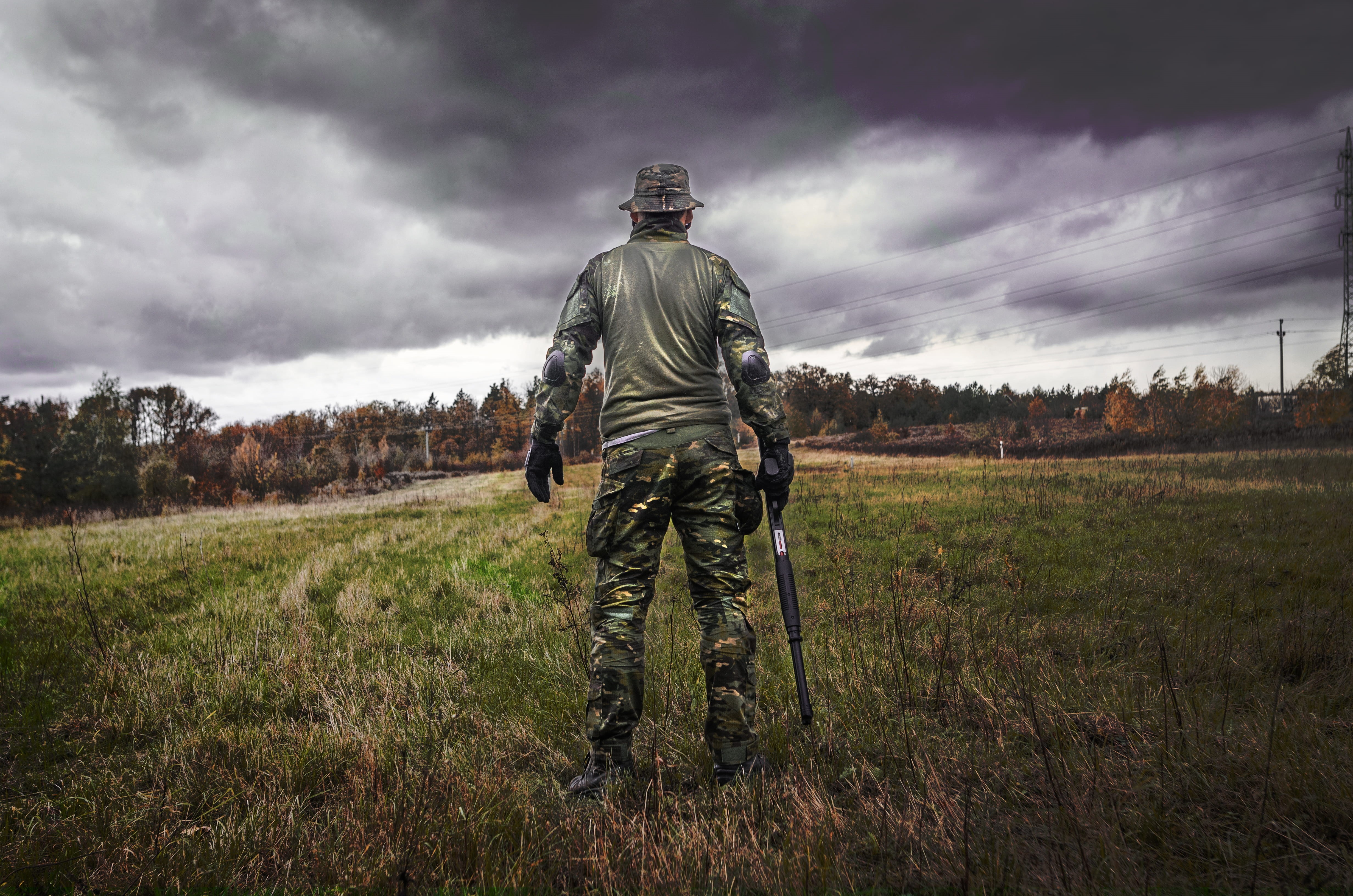 camouflage, combat, holding, m16, gun, adult, helmet, uniform, man, clothing, armed forces, cloud - sky, people, armed, solo, land, army, protection, nature, HD Wallpaper
