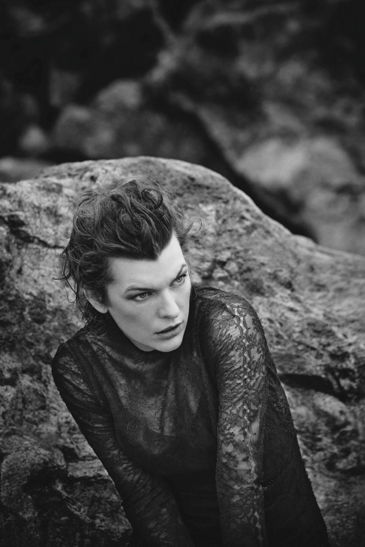 actress, clothing, one person, hairstyle, portrait, focus on foreground, young adult, monochrome, rock, 720P, waist up, adult, model, rock - object, Milla Jovovich , Phone HD Wallpaper