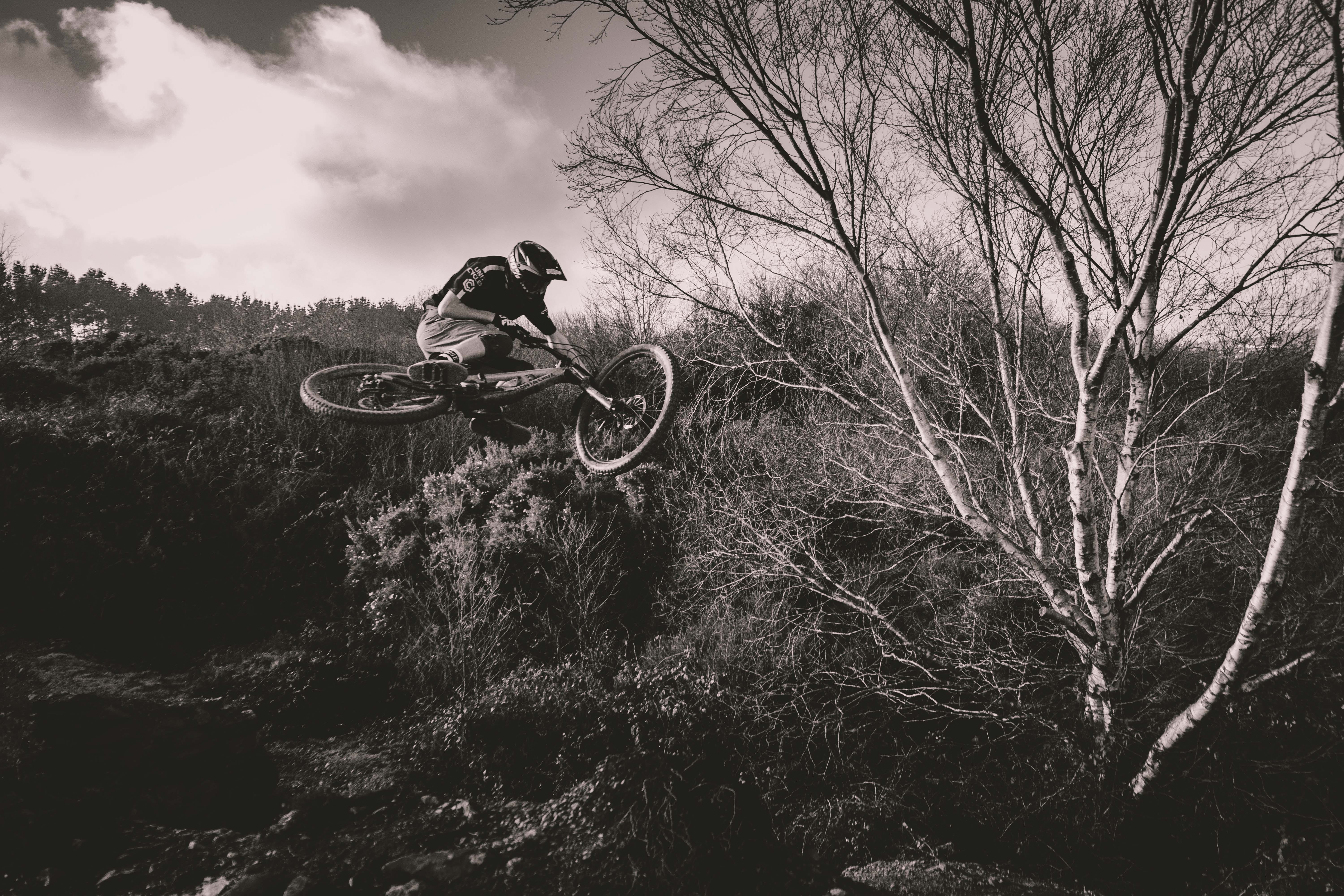 headwear, biker, bare tree, land vehicle, bicycle, adventure, outdoors, extreme sports, sport, lifestyles, one person, mode of transportation, Mountain bike, HD Wallpaper