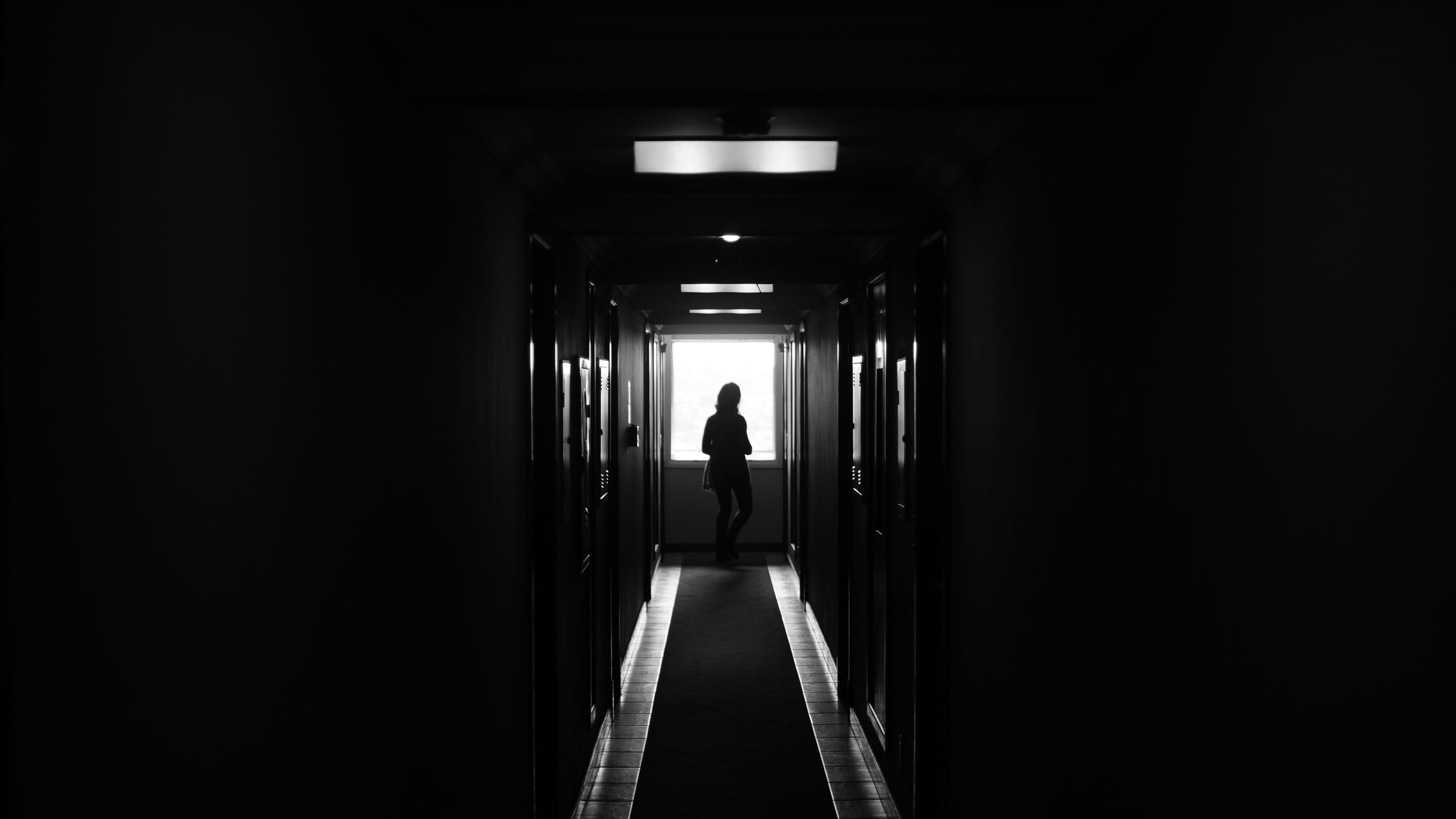 building, monochrome photography, lifestyles, men, incidental people, light at the end of the tunnel, indoor, standing, adult, person, one person, illuminated, HD Wallpaper