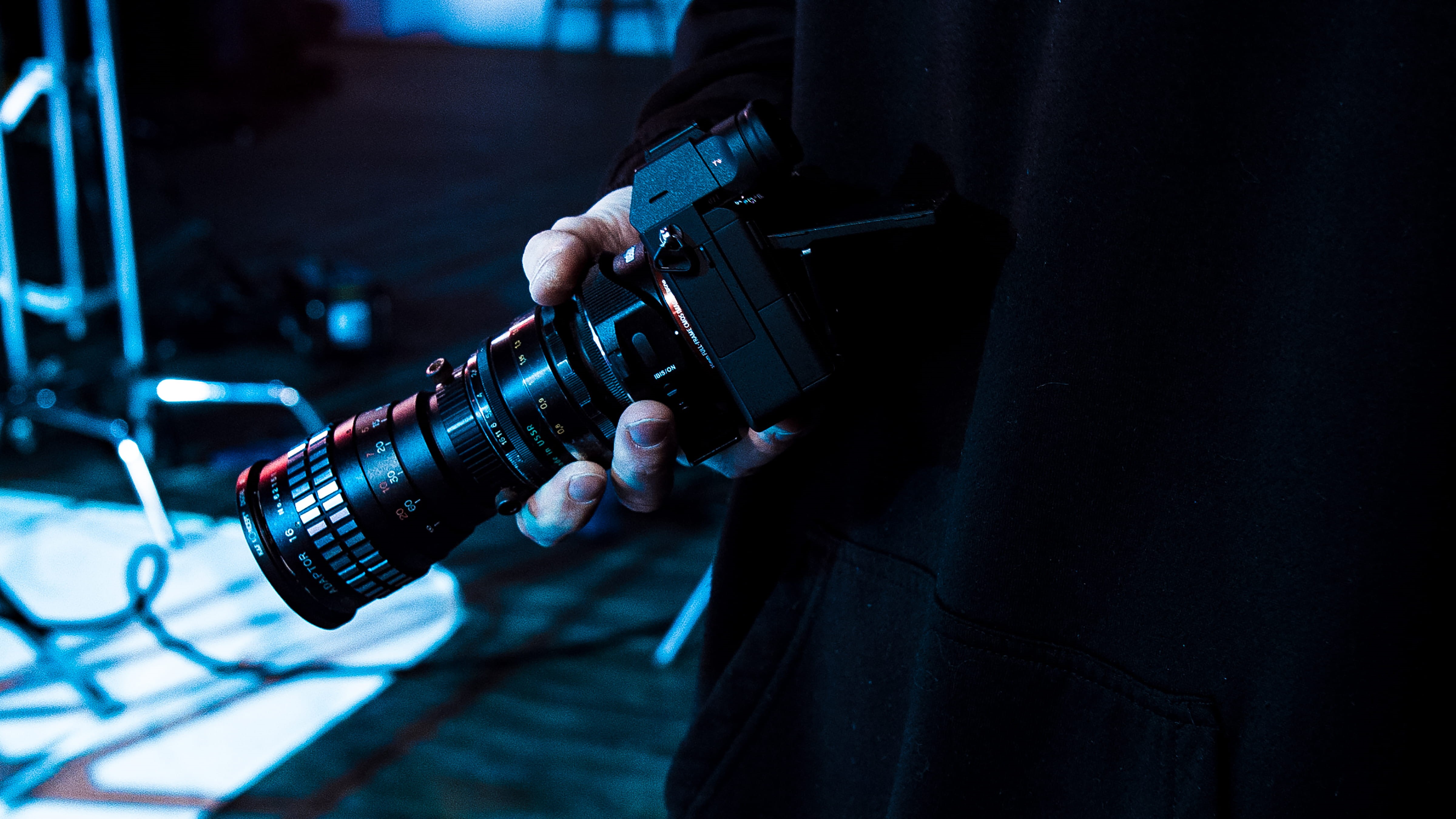 bokeh, electronics, human body part, electrical equipment, dark, human hand, sony, anamorphic, blur, film industry, skill, lighting, technology, HD Wallpaper