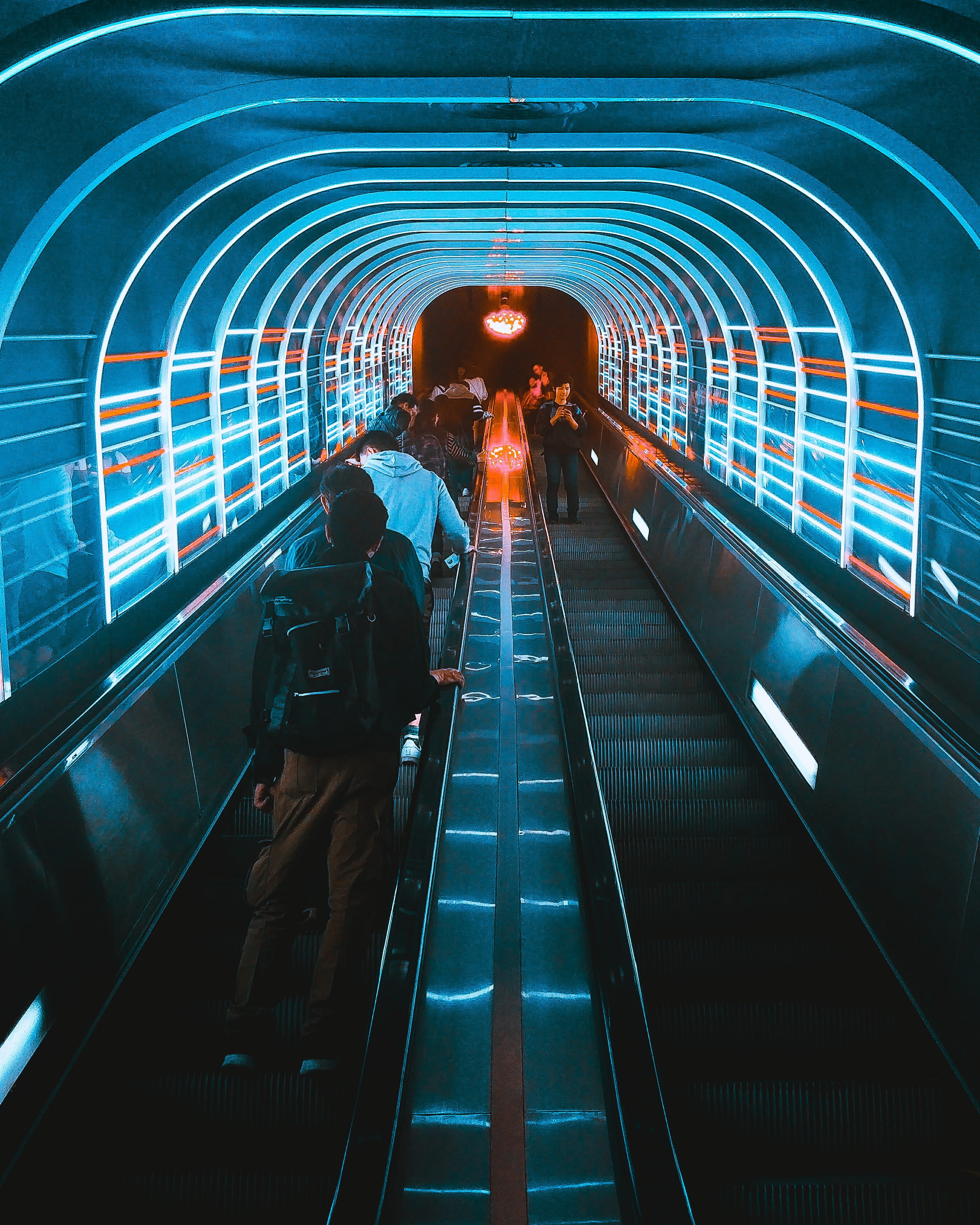 escalators, arch, escalator, dark, the way forward, tunnel, light, 2K, standing, cold, illuminated, real people, phone, steps and staircases, modern, tone, Phone HD Wallpaper