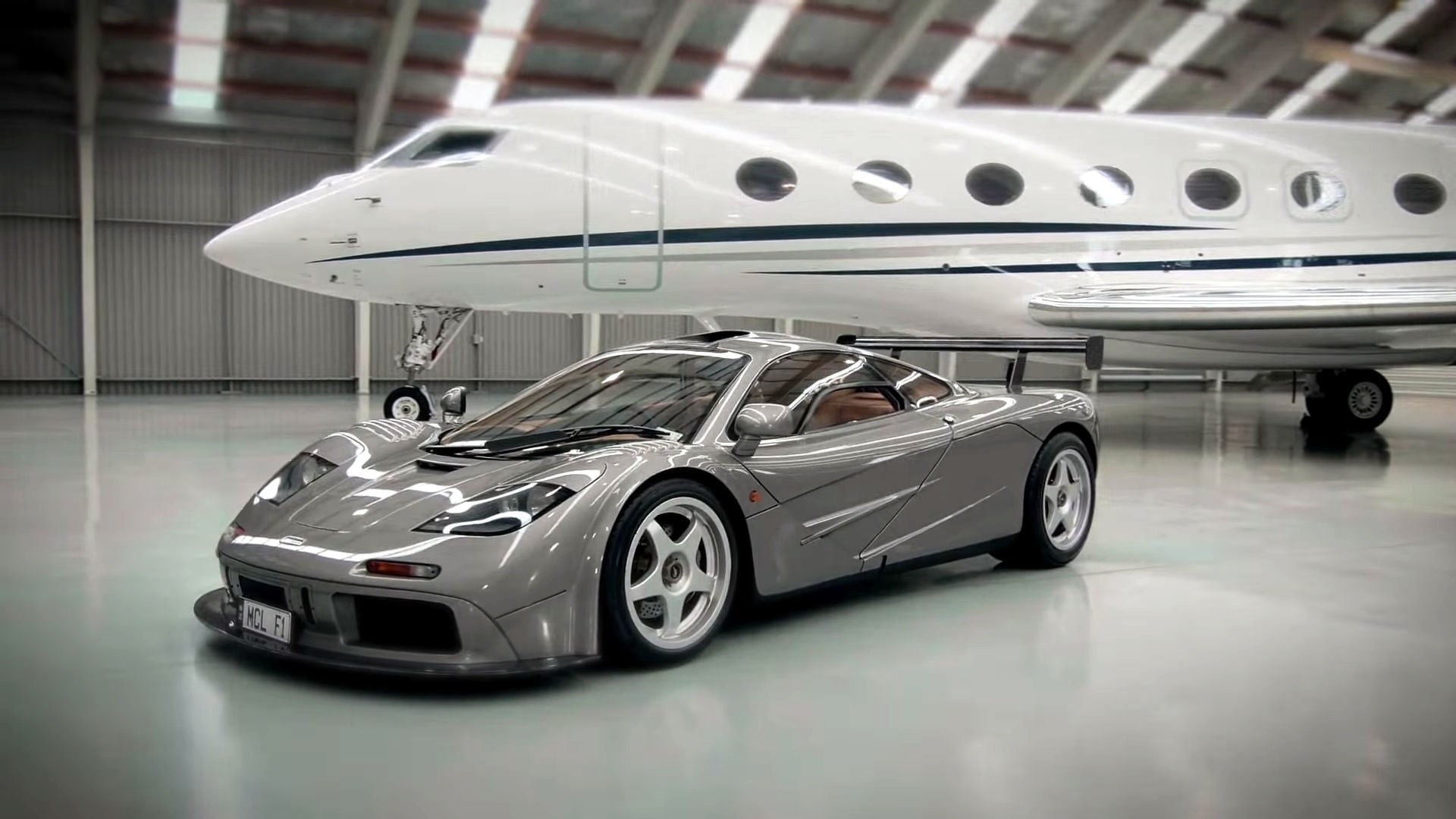 bmw, car, shiny, indoors, parking lot, racecar, metal, McLaren F1, mode of transportation, silver colored, no people, vehicle, land vehicle, sports car, HD Wallpaper