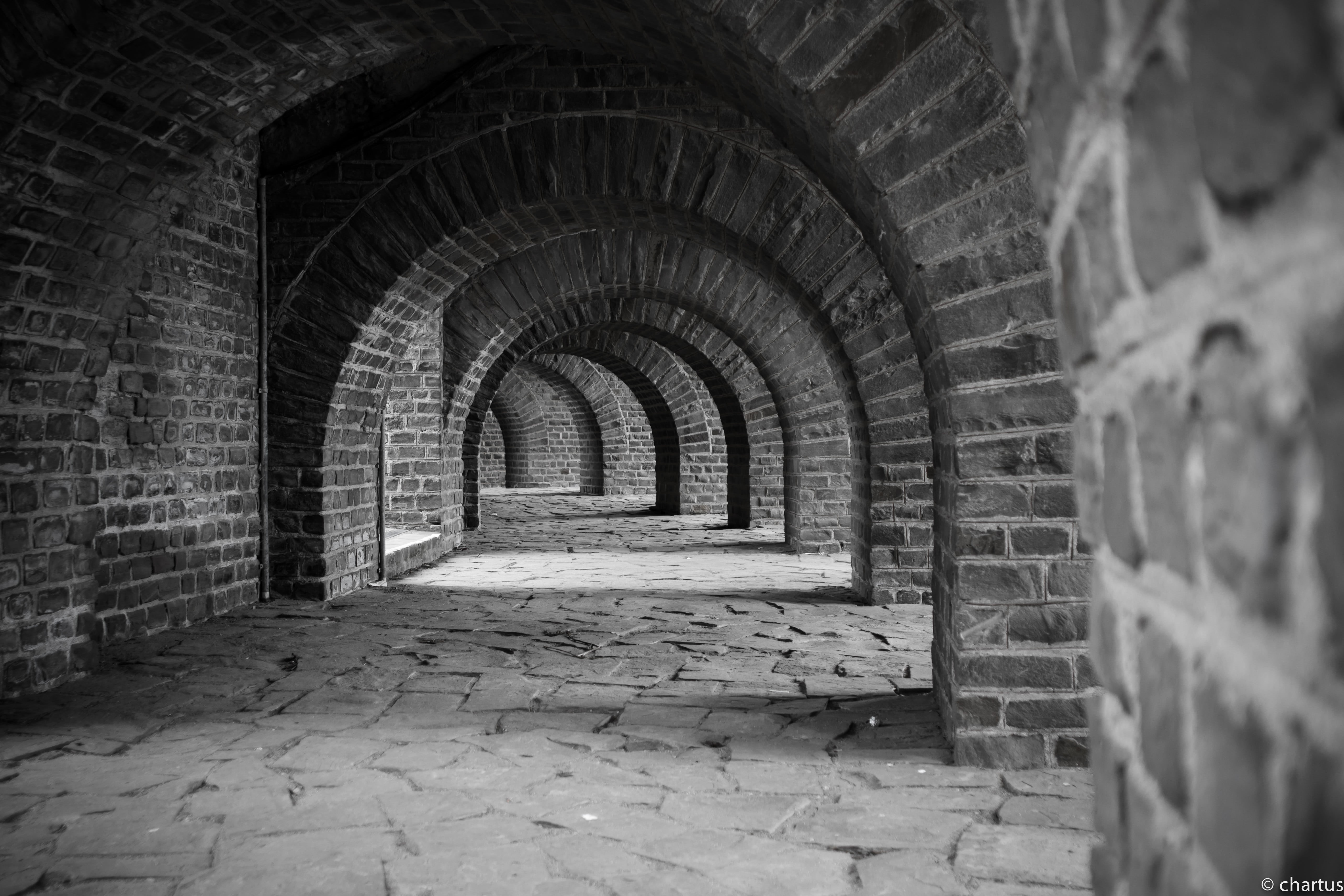brick, day, no people, stone wall, outdoors, building, 5K, wheel, brick wall, gates, arch, tunnel, the past, old, pattern, monochrome, wall, direction, HD Wallpaper