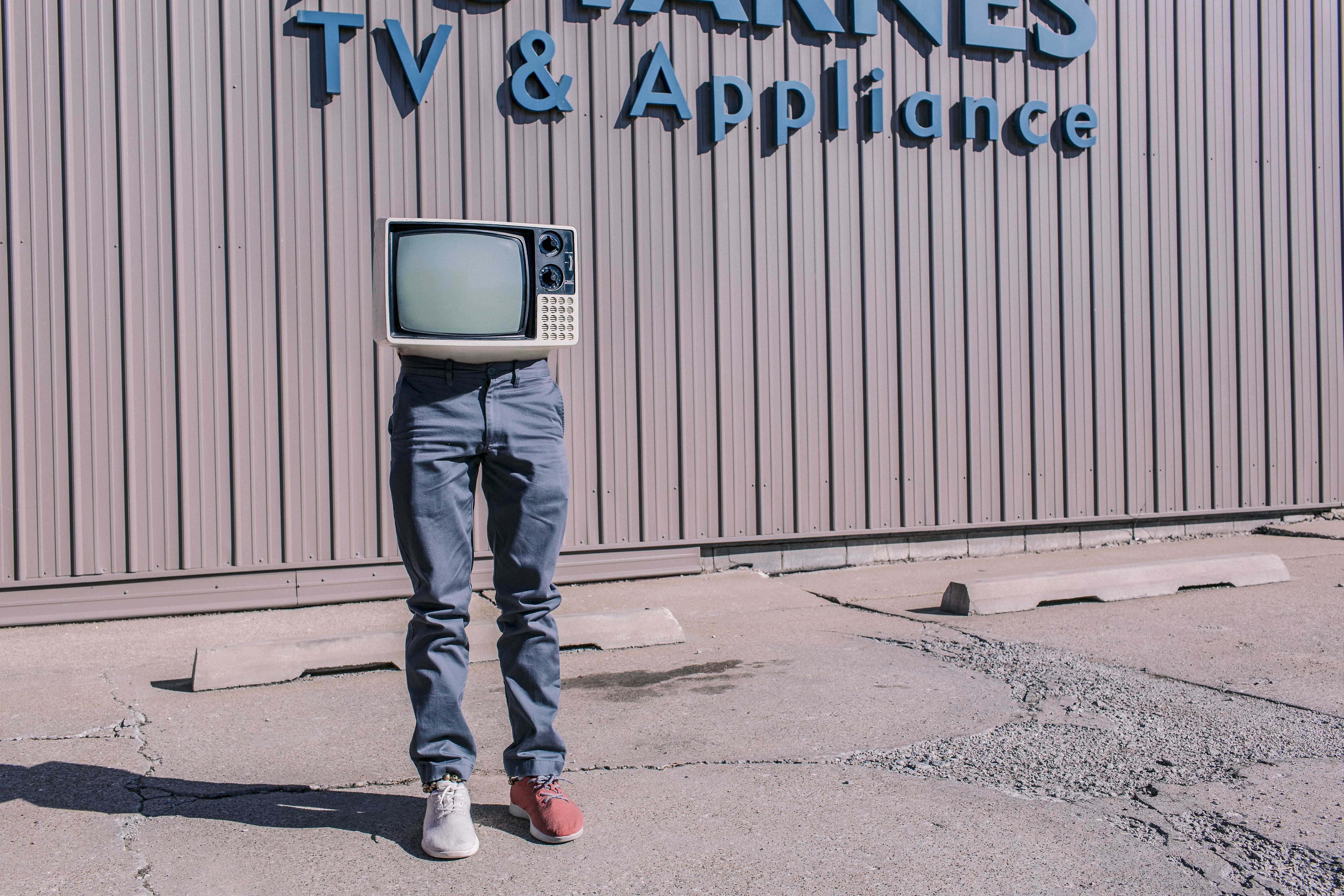 person, legs, wierd, text, gray, white, denim jeans, monster, CRT television, iron, lazy, red sneakers, one man only, humor, architecture, men, full length, HD Wallpaper