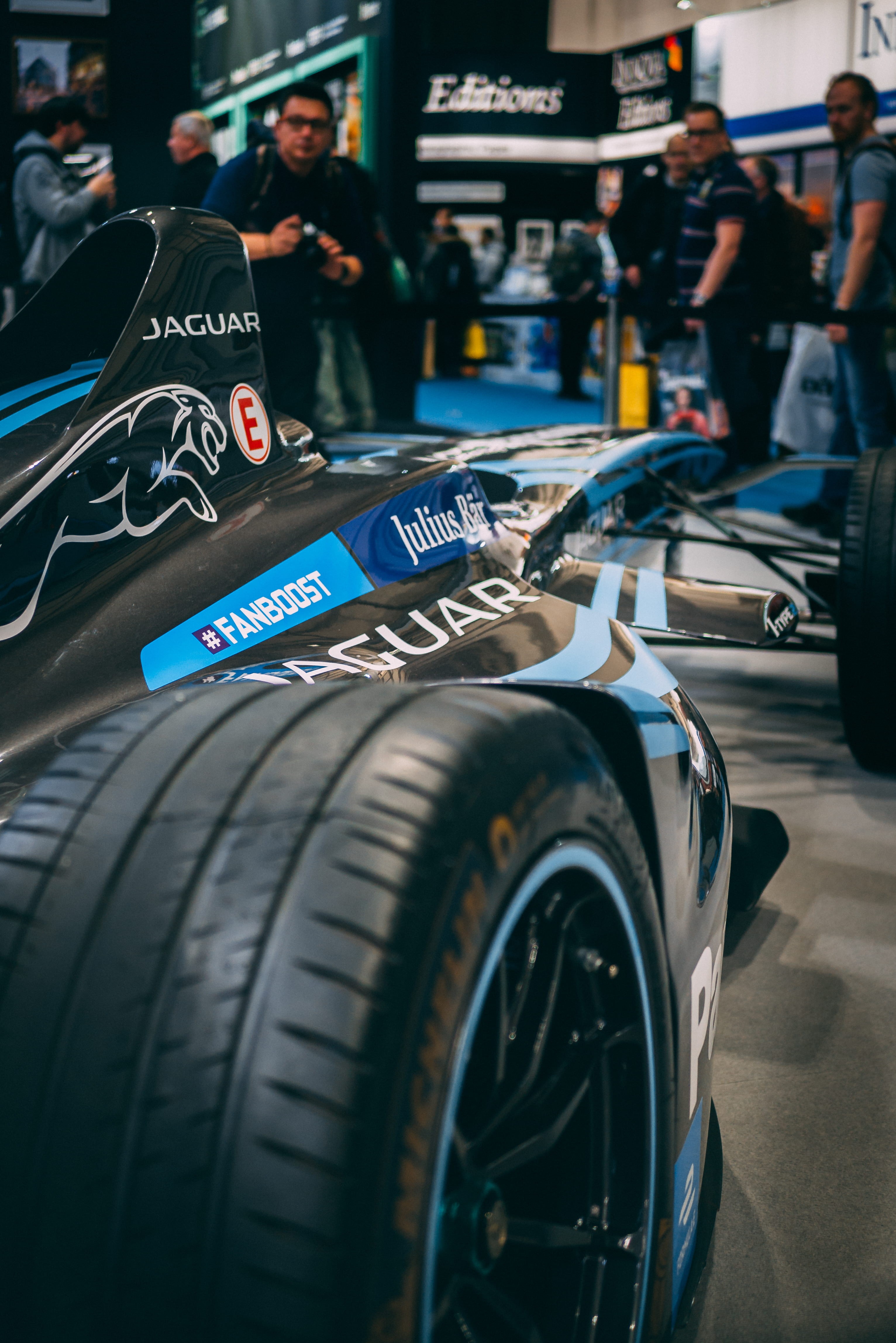 text, race car, real people, competition, mode of transportation, outdoors, car, land vehicle, day, selective, western script, jaguar, 4K, city, focus on foreground, Phone HD Wallpaper