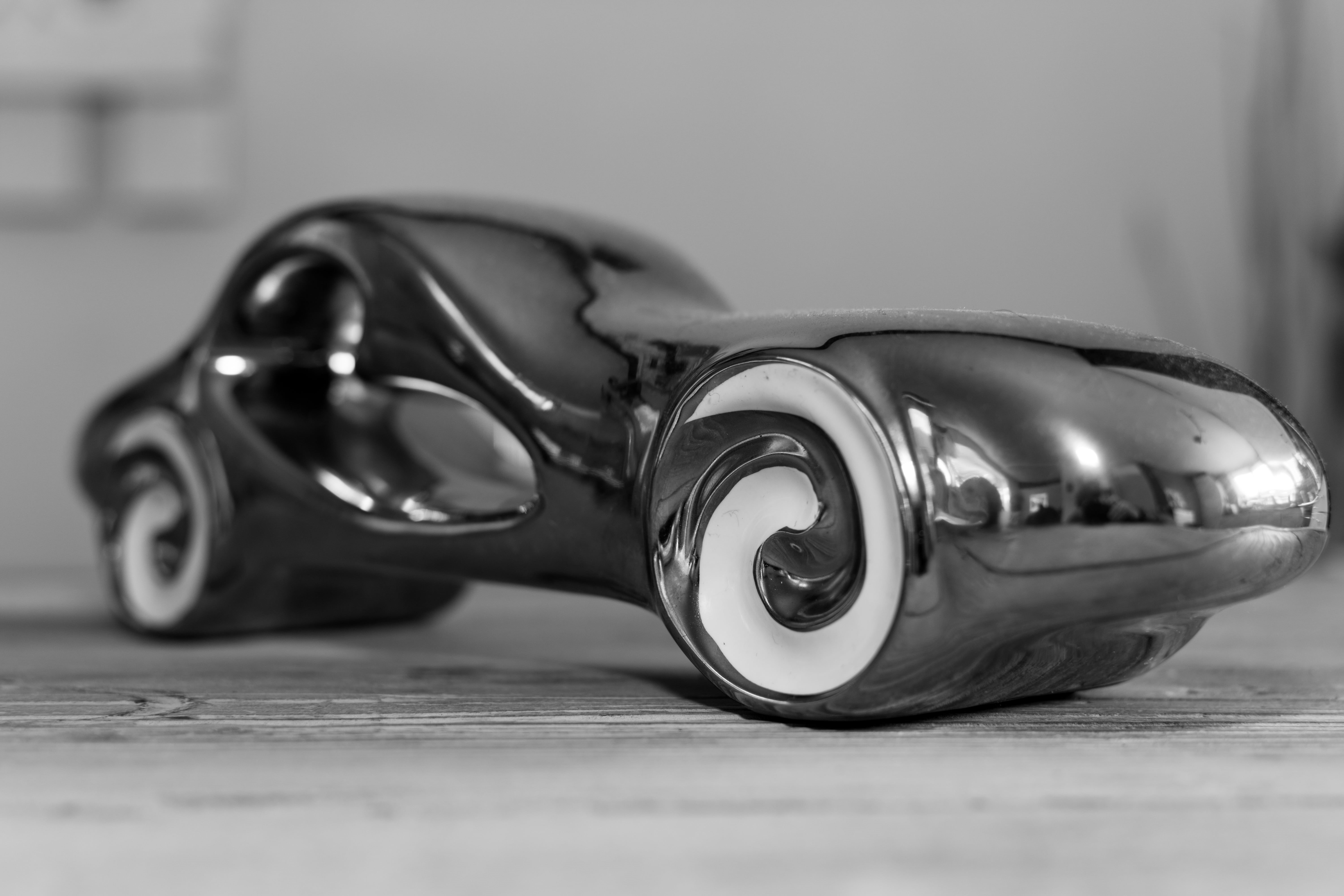 close-up, selective focus, flooring, streamline, black and white, 5K, metal, security, shiny, no people, toy, car statuette, day, single object, still life, HD Wallpaper