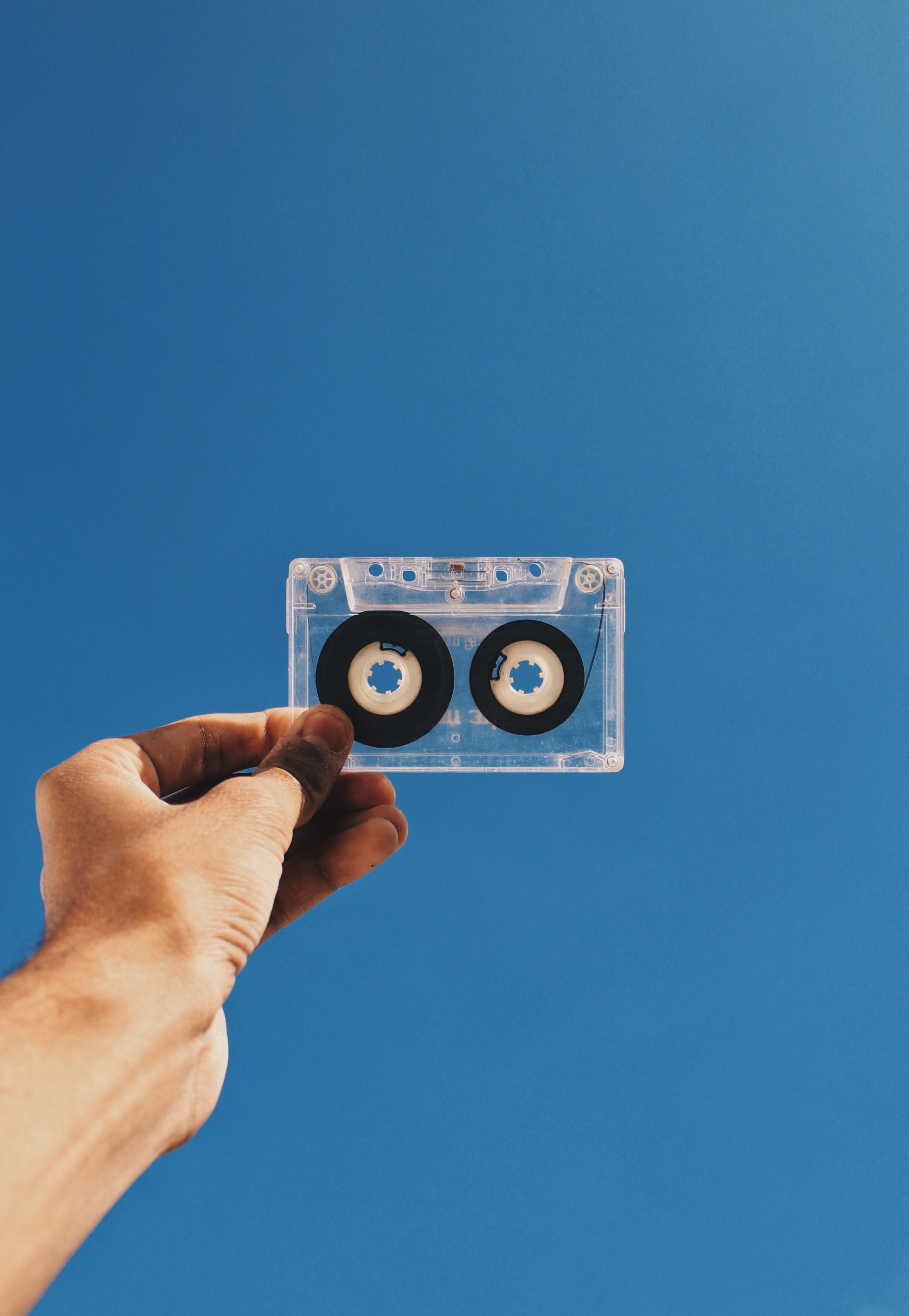indoors, blue, record, device, hand, copy space, finger, equipment, studio shot, Analogue, obsolete, low angle view, person, clear sky, sky, blue background, Phone HD Wallpaper