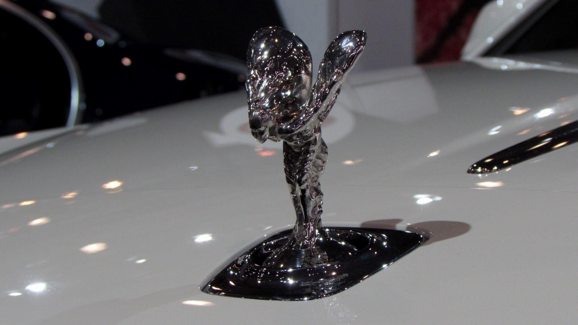 silver colored, falling, wealth, drop, ecstasy, indoors, reflection, night, 1080P, rolls royce, illuminated, studio shot, cars, close-up, emblem, no people, HD Wallpaper