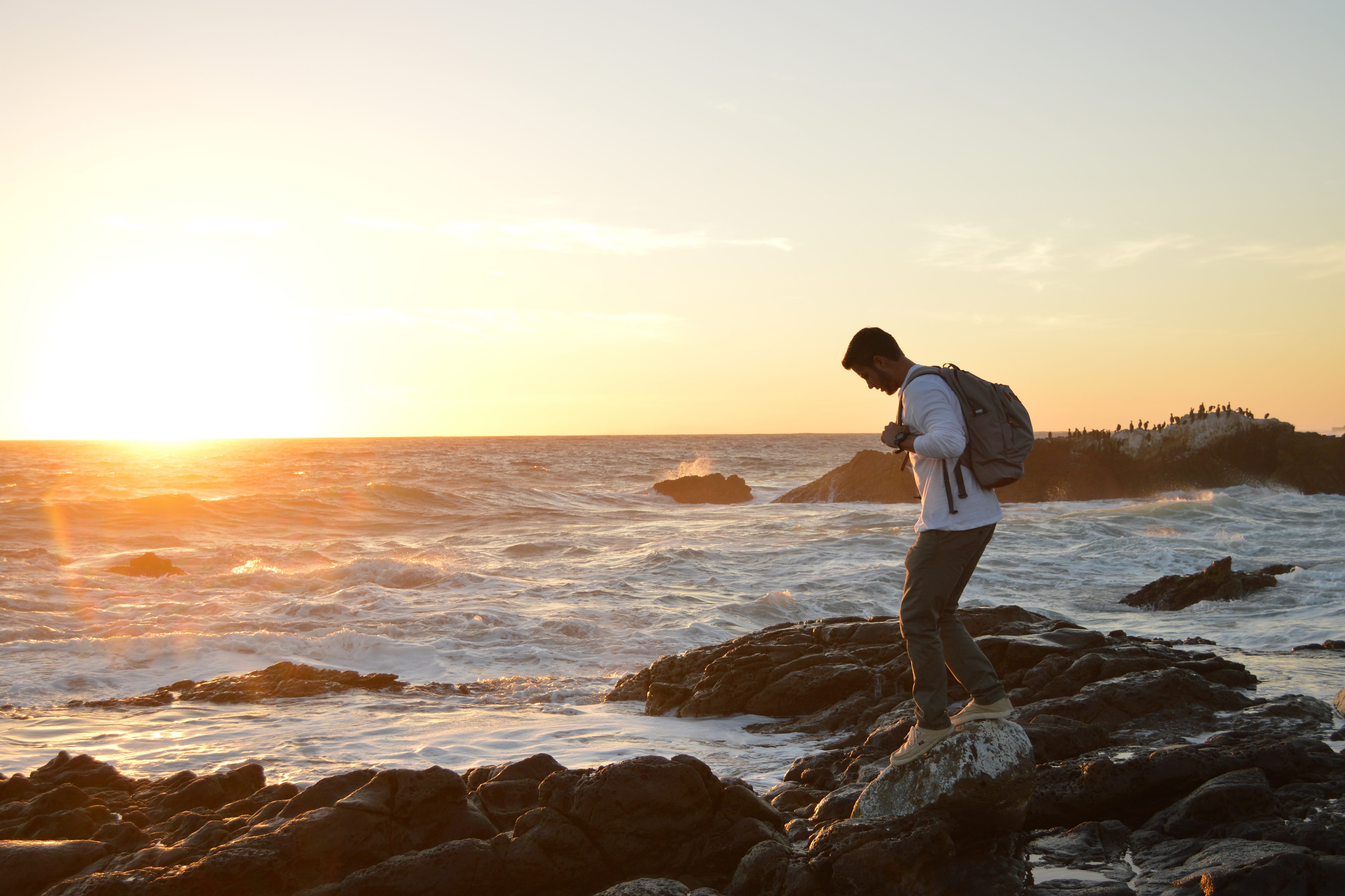 rocky coast, 4K, summer, leisure activity, adult, casual clothing, nature, one Person, sea, sky, solid, sunset, land, walking on, full length, rock - object, HD Wallpaper