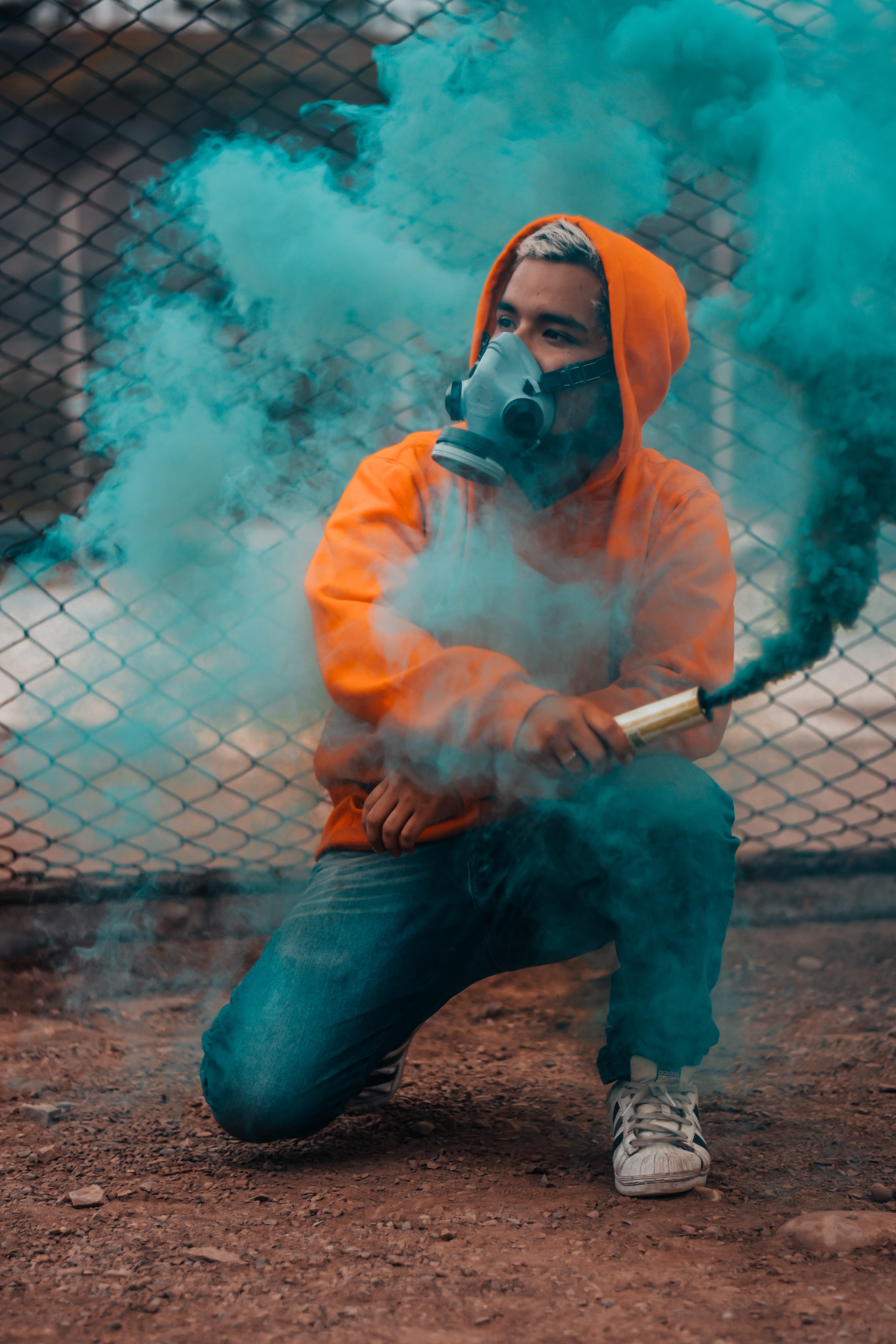 person, one person, standing, day, 5K, man, young men, full length, casual clothing, daytime, men, photo, bomb, smoke, fence, smoke - physical structure, Phone HD Wallpaper