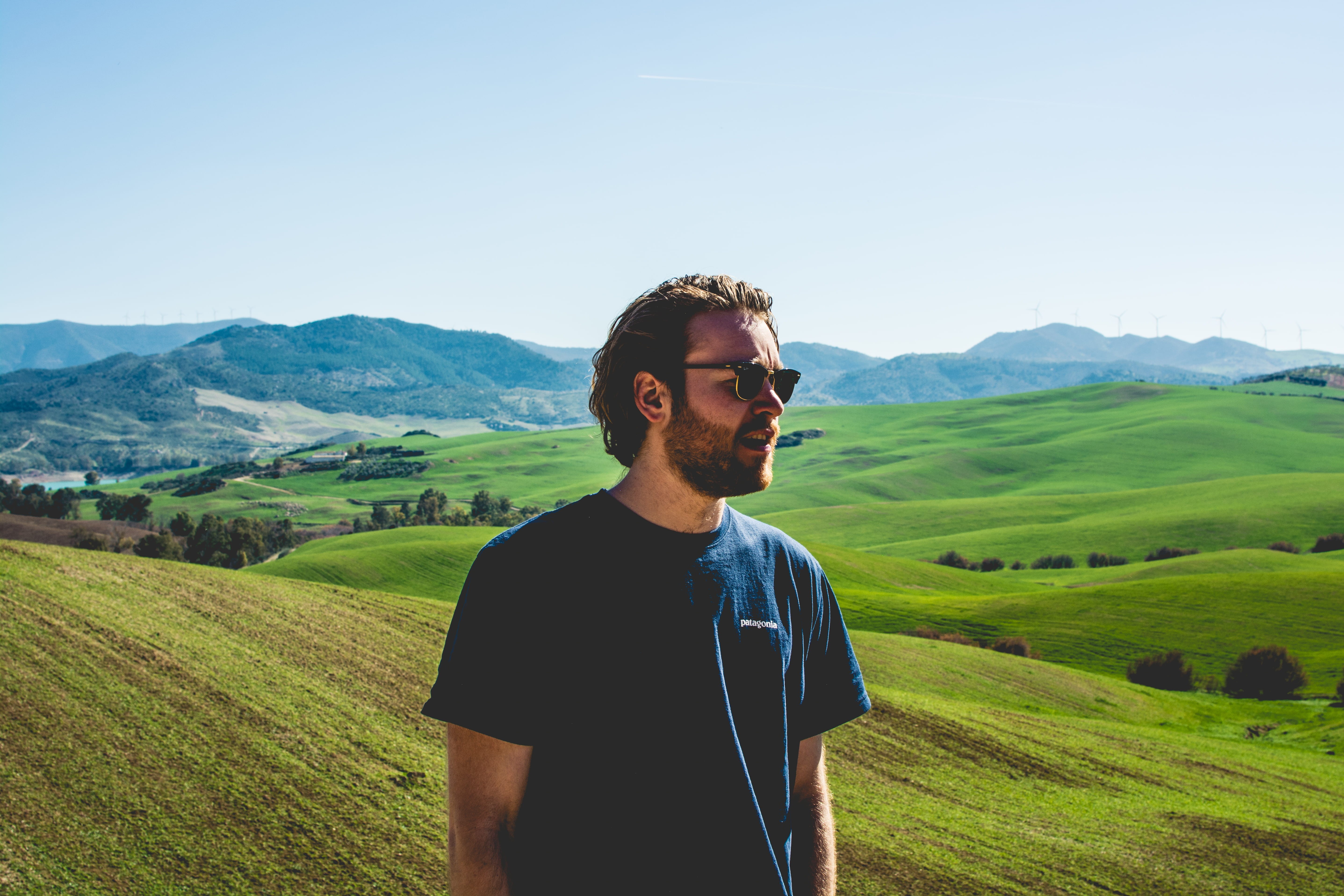 plant, young adult, crew, man, beauty in nature, neck, casual clothing, male, young men, sunlight, black, landscape, nature, hills, grass, wearing, one person, HD Wallpaper