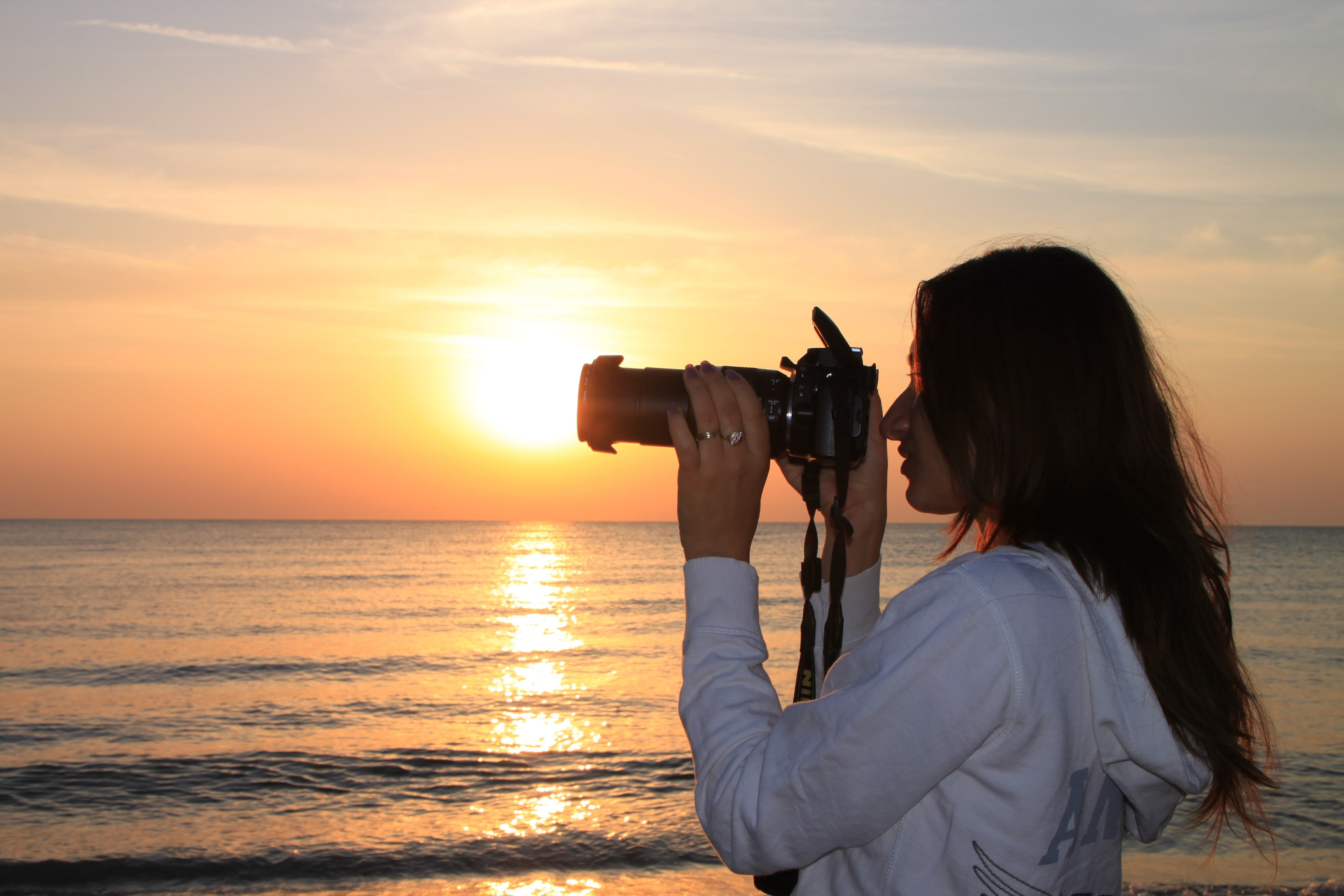 photographing, photography Themes, people, technology, camera, sun, waves, hour, sunset, land, digital camera, vacations, occupation, adult, looking, 4K, HD Wallpaper