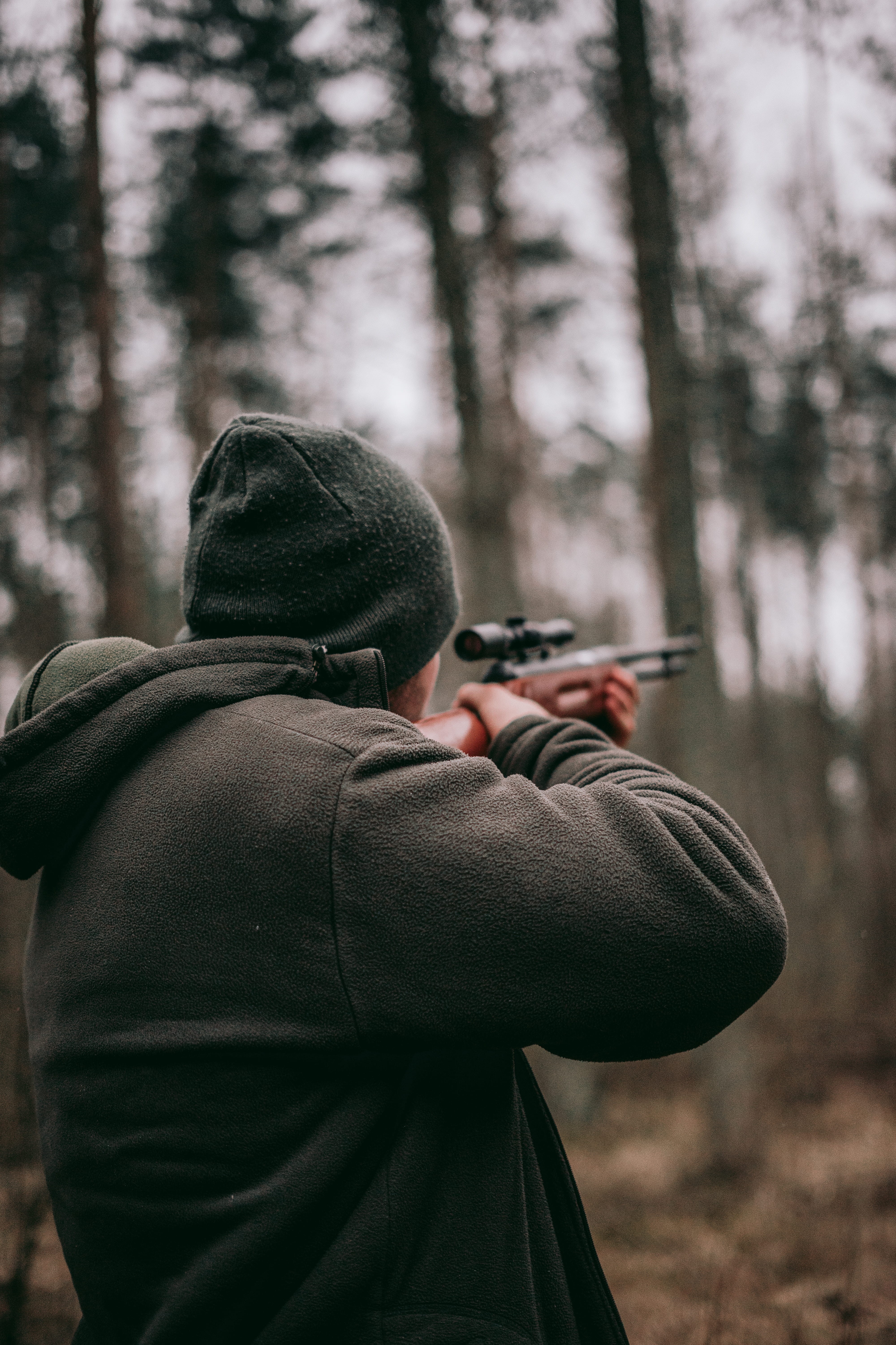hoodie, real people, leisure activity, warm clothing, forest, hunting, sniper, people, clothing, lifestyles, photographing, one person, depth of field, Phone HD Wallpaper