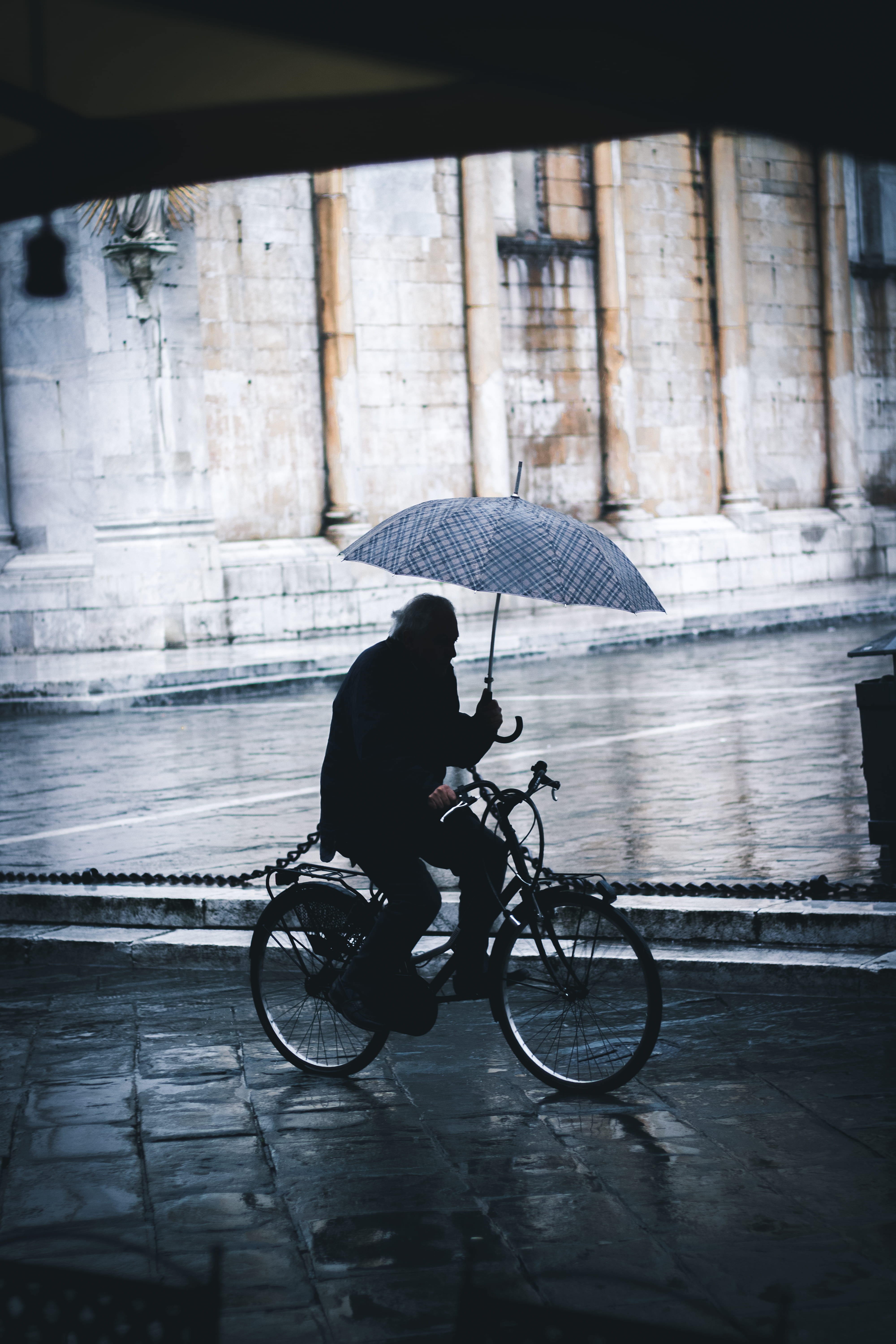 mode of transportation, full length, land vehicle, holding, rain, raining, one person, faceless, old man, old age, transport, wall, person, sidewalk, water, Phone HD Wallpaper