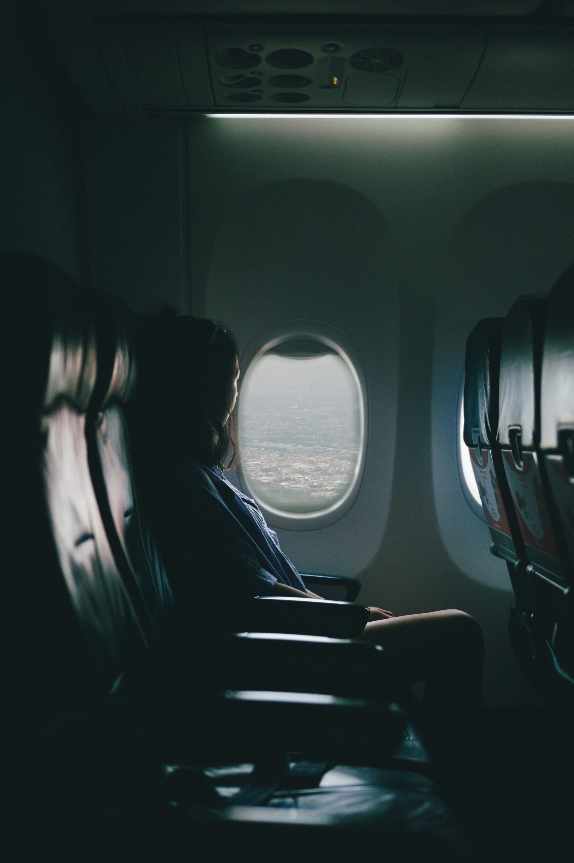view, sitting, black, flight, plane, mode of transportation, indoors, air vehicle, looking out, near, person, journey, transportation, chair, hairstyle, Phone HD Wallpaper