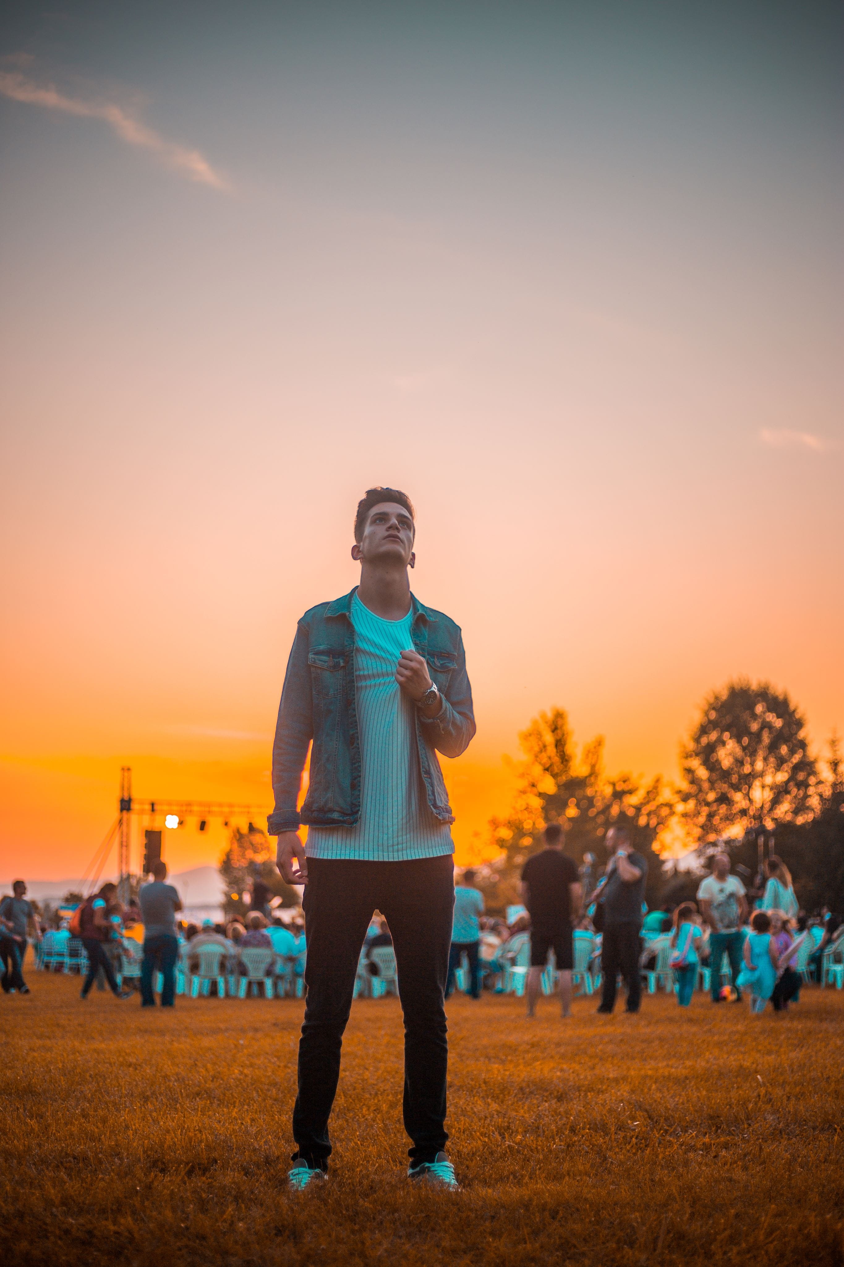 dawn, clothing, human, full length, standing, golden, building, upward, young adult, crowd, leisure activity, young men, sunrise, flare, real people, one person, Phone HD Wallpaper