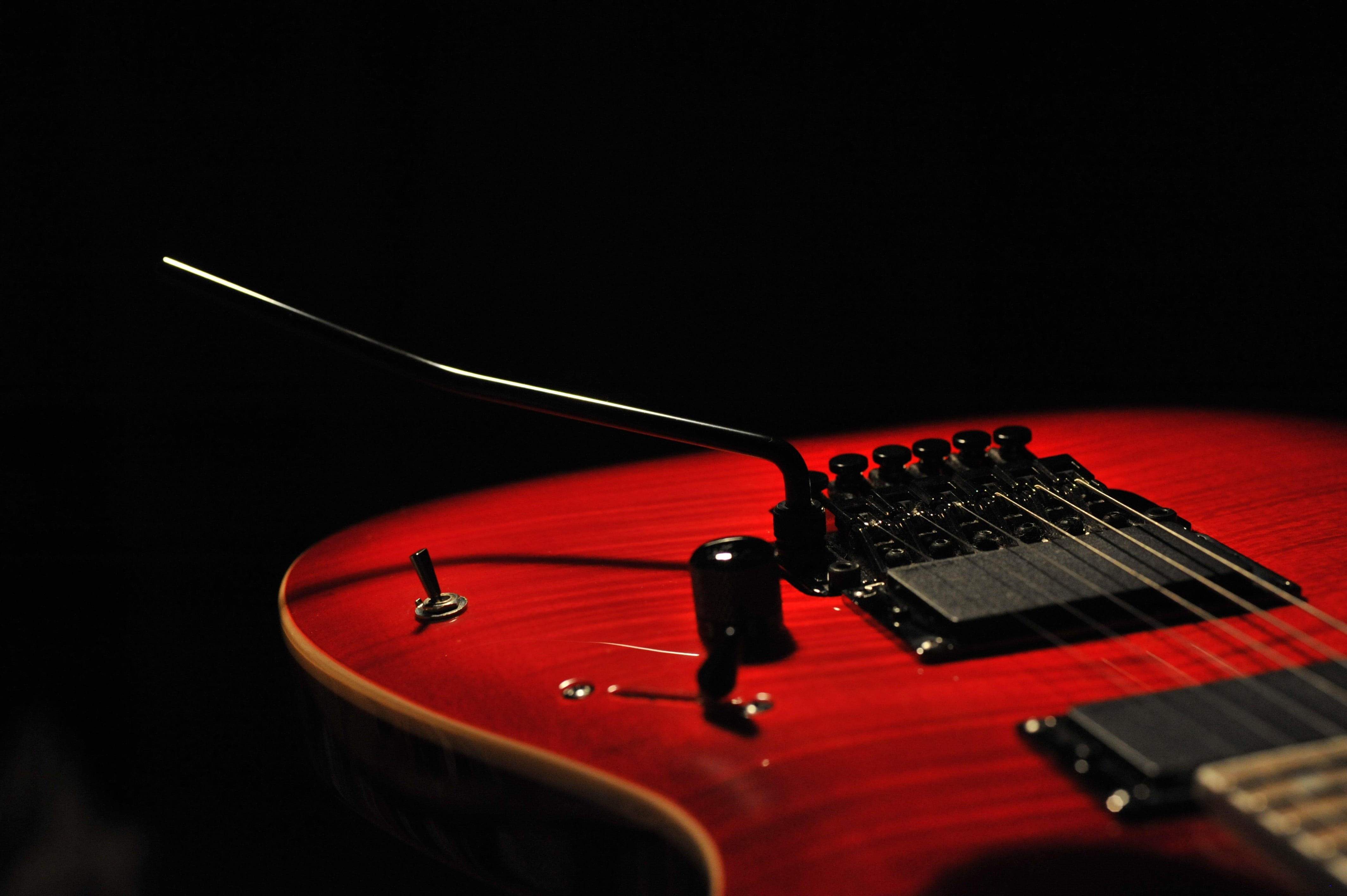 musical instrument, no people, audio equipment, black color, indoors, performance, red, black background, rock, string, rock music, music, event, close-up, HD Wallpaper