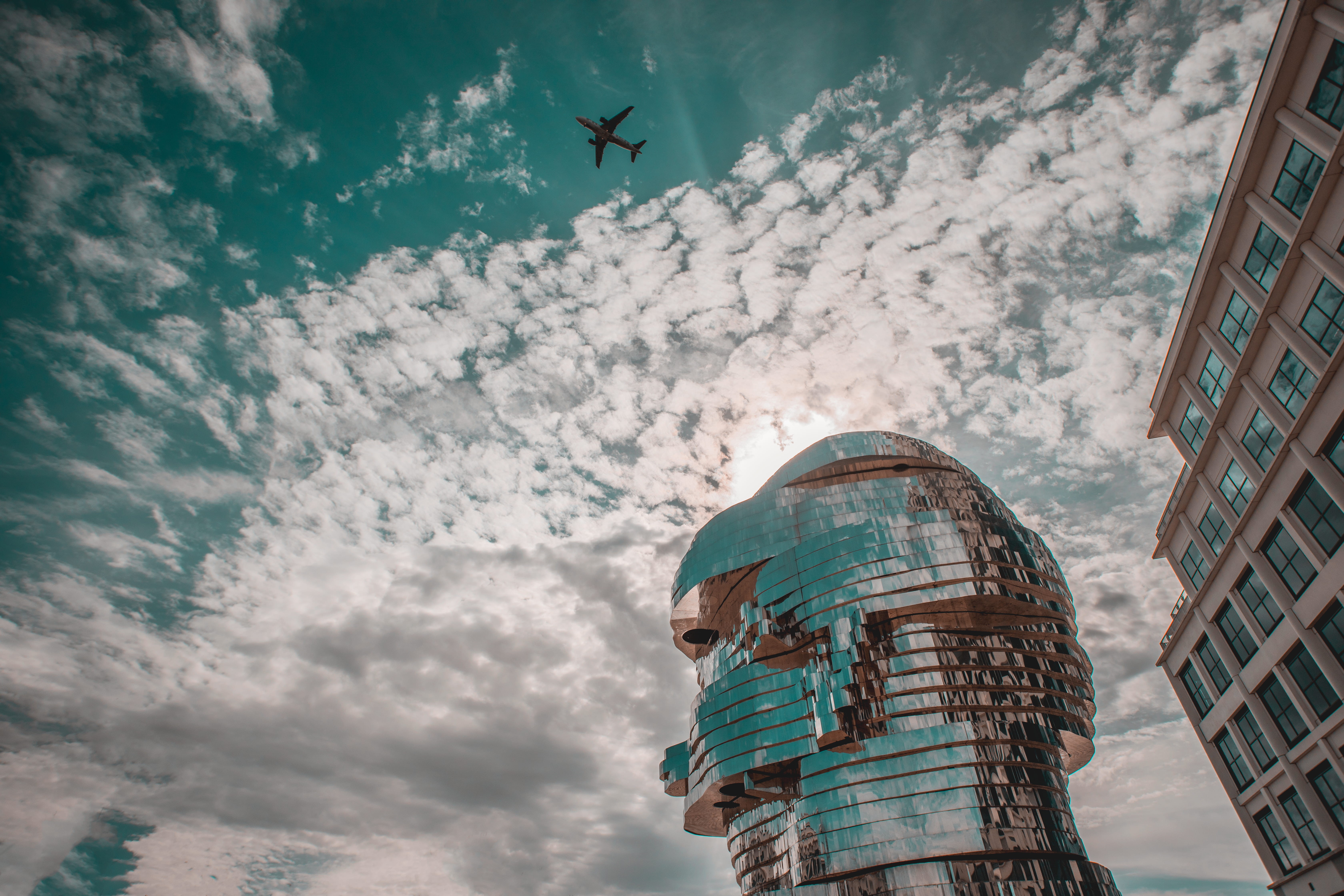 built structure, low angle view, cloud - sky, plane, dome, city, moving, aircraft, deform, travel, office building exterior, deformation, skyscraper, transportation, HD Wallpaper