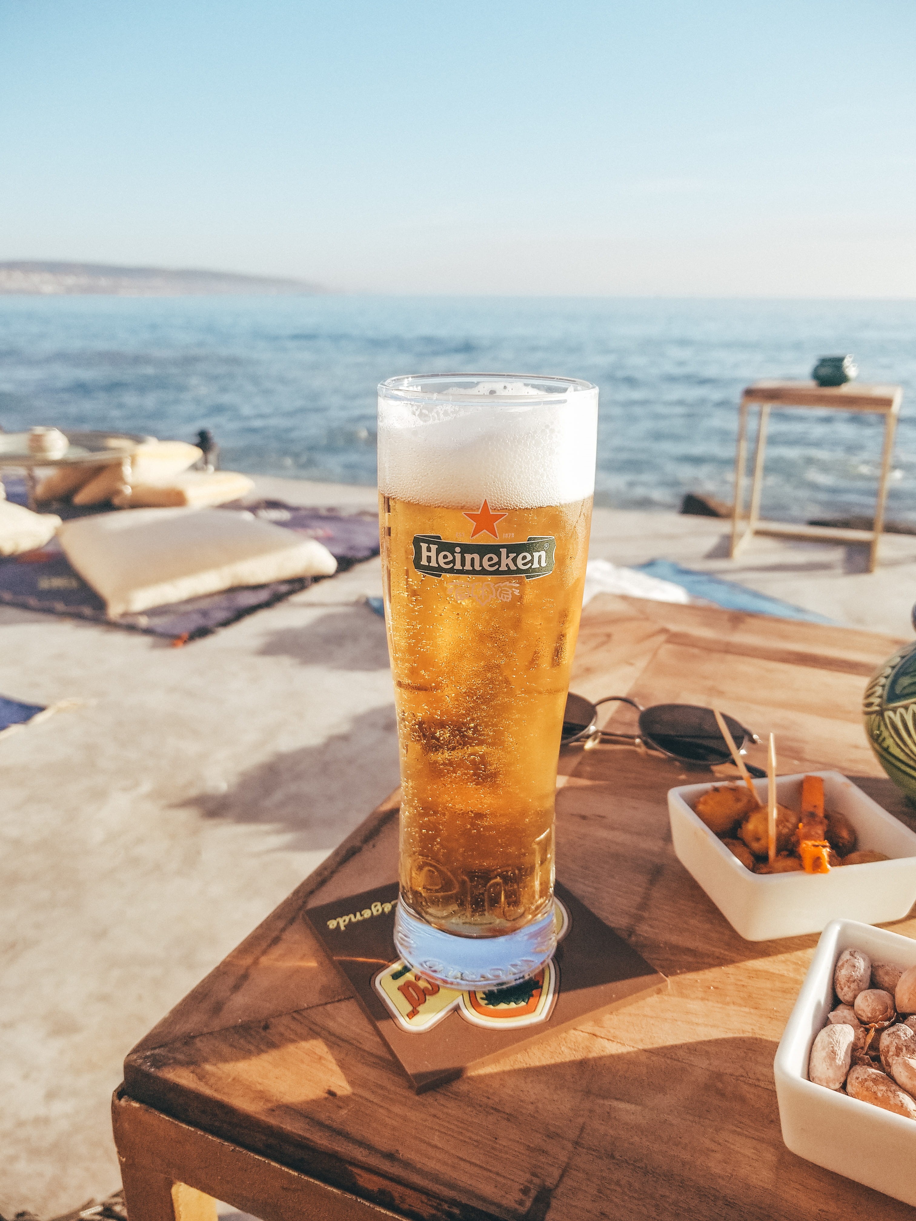 household equipment, goblet, no people, bar, beverage, beer glass, lager, freshness, 4K, beer, sea, heineken, plant, filled, food, furniture, relax, tabletop, Phone HD Wallpaper