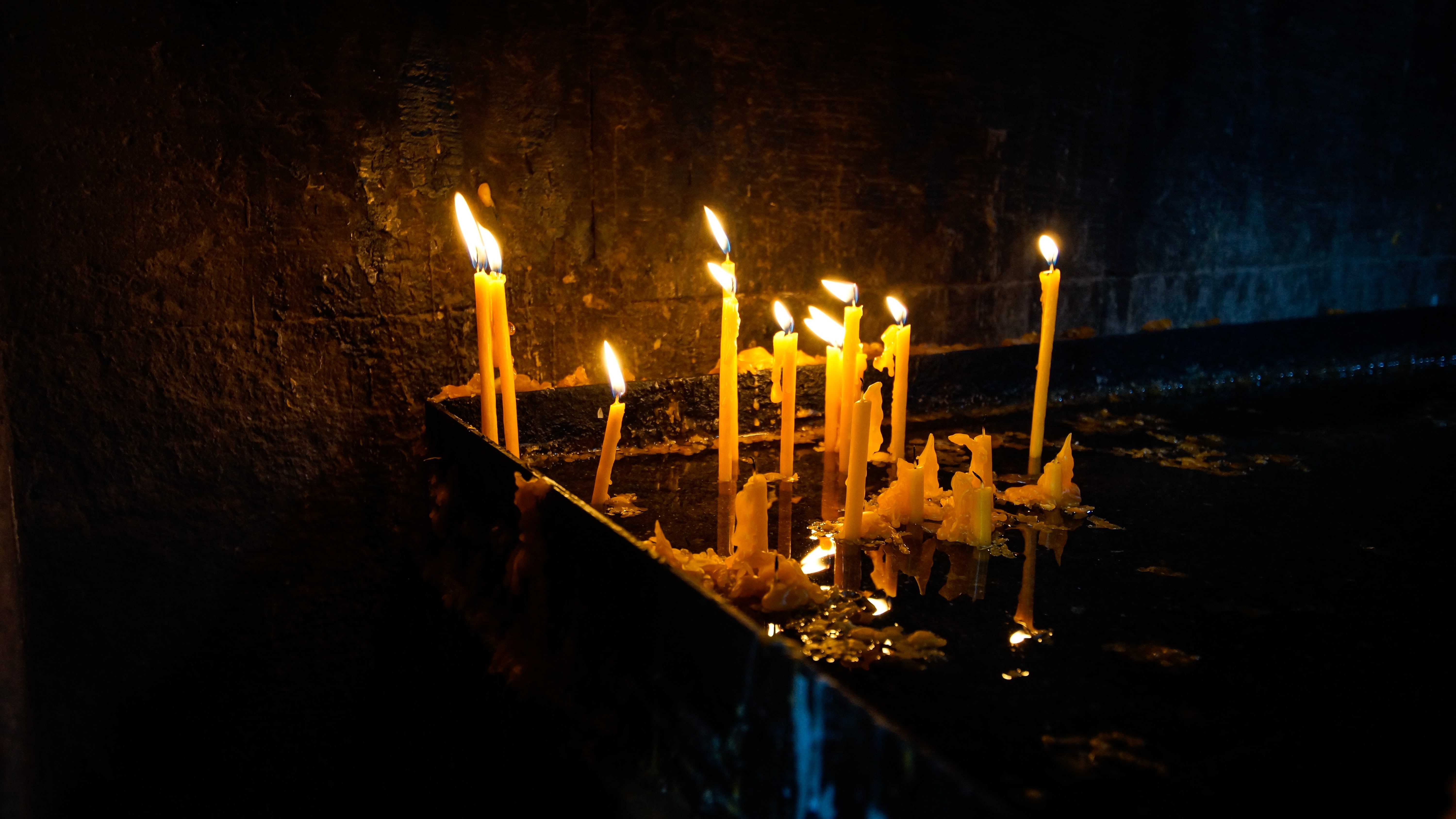 praying, spirituality, built structure, religious, fire, night, 5K, christianity, flame, glowing, no people, sacrificial lights, place of worship, light, HD Wallpaper