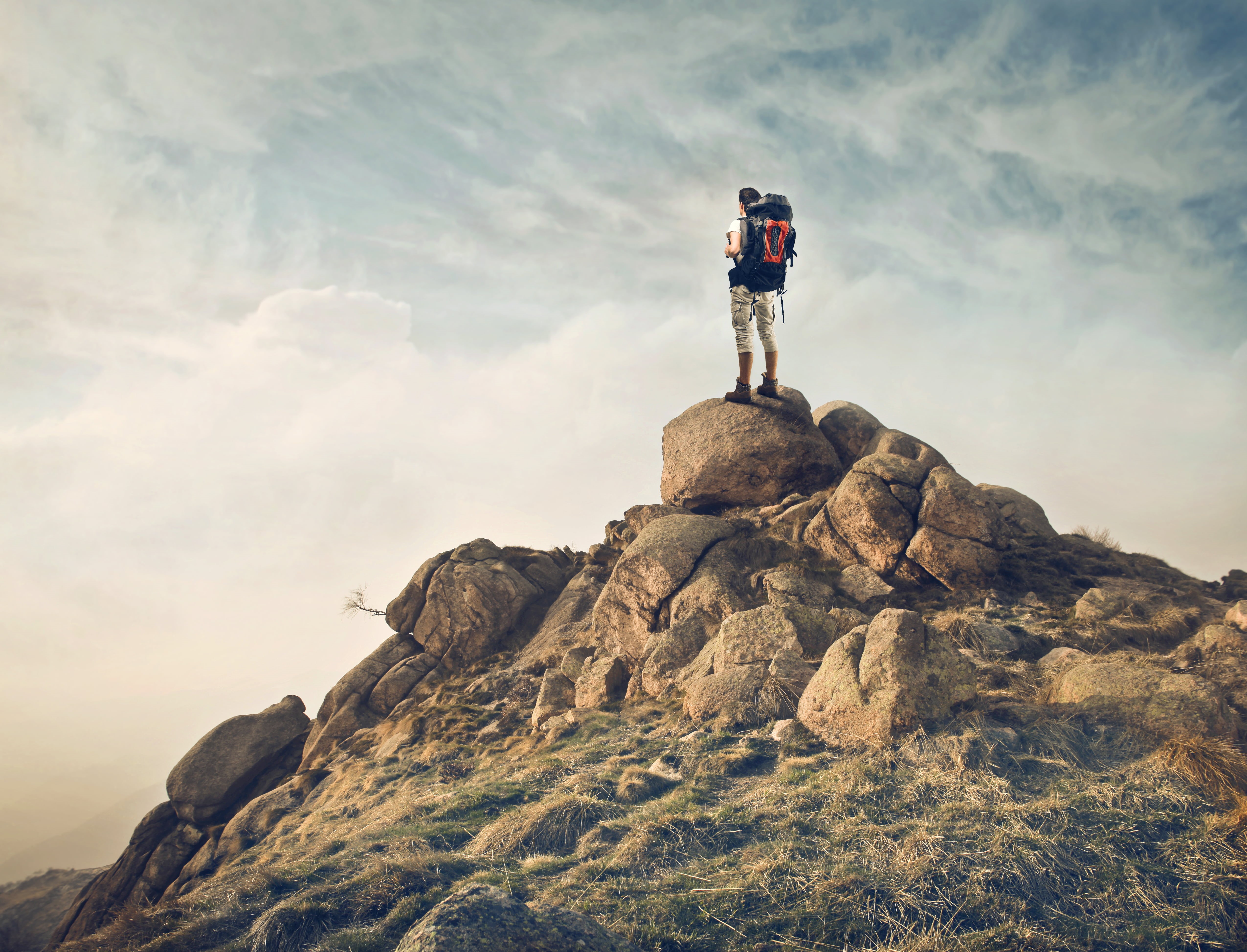 one person, lifestyles, solid, nature, 4K, daylight, cloud - sky, rock, mountain peak, rocks, foggy, scenic, remote, adventure, hiker, leisure activity, HD Wallpaper