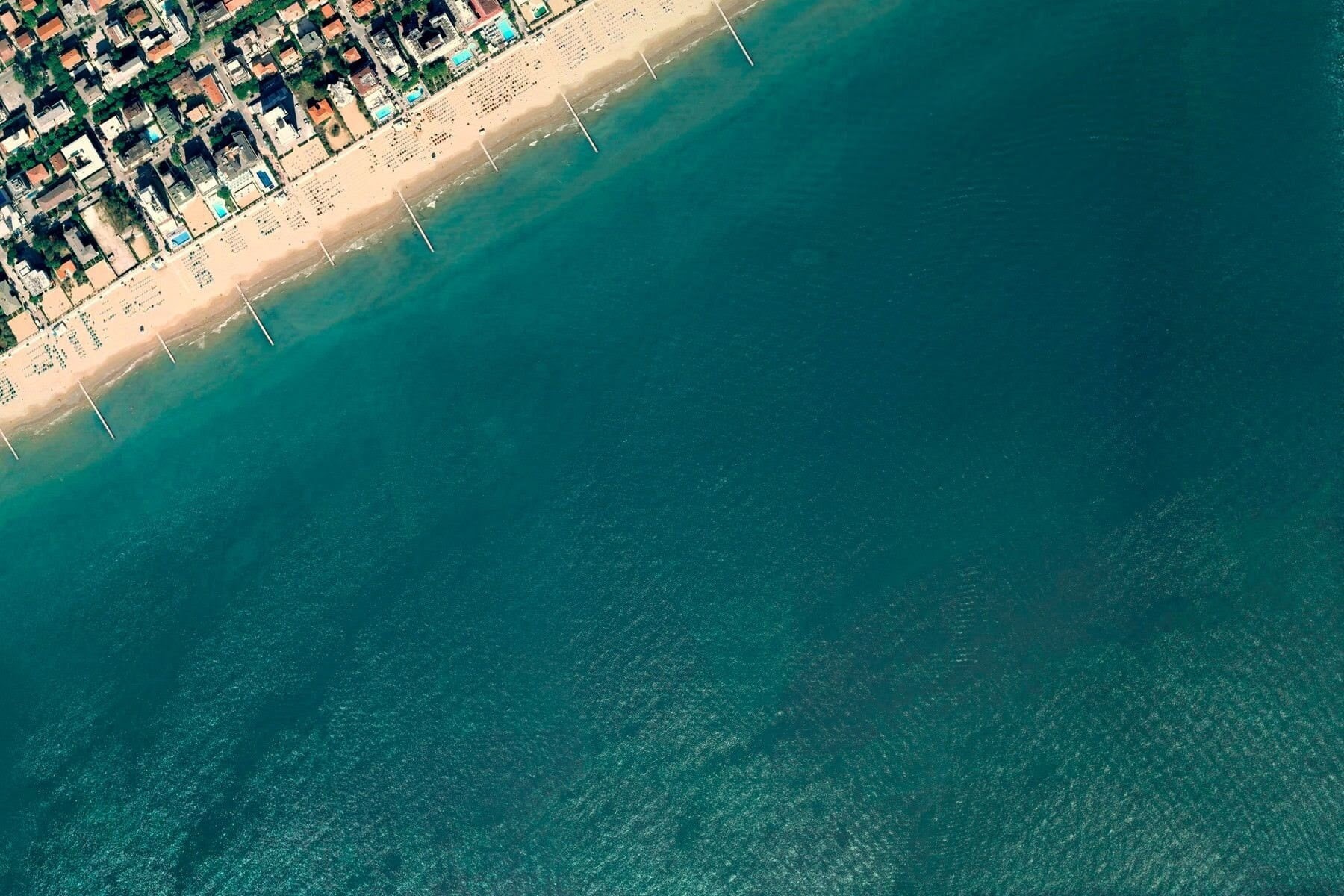 vacations, village, building exterior, sand, sunny, photography, no people, body, day, high Angle View, aerial View, swimming pool, cityscape, blue, aerial, HD Wallpaper