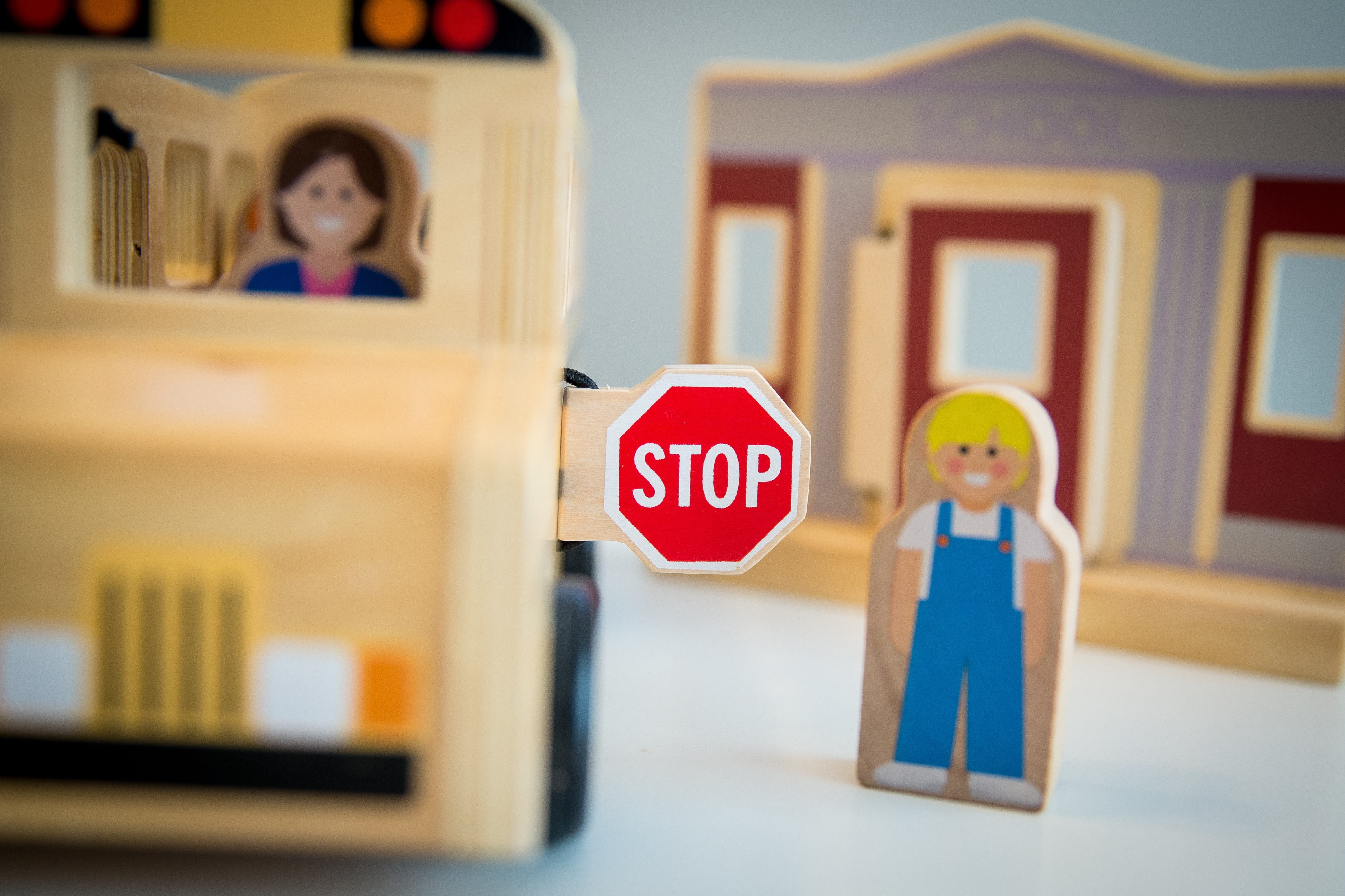 western script, text, toy, 4K, school bus, art, child, one person, children, stop sign, fun, happiness, safety, childhood, offspring, indoors, boys, capital letter, HD Wallpaper