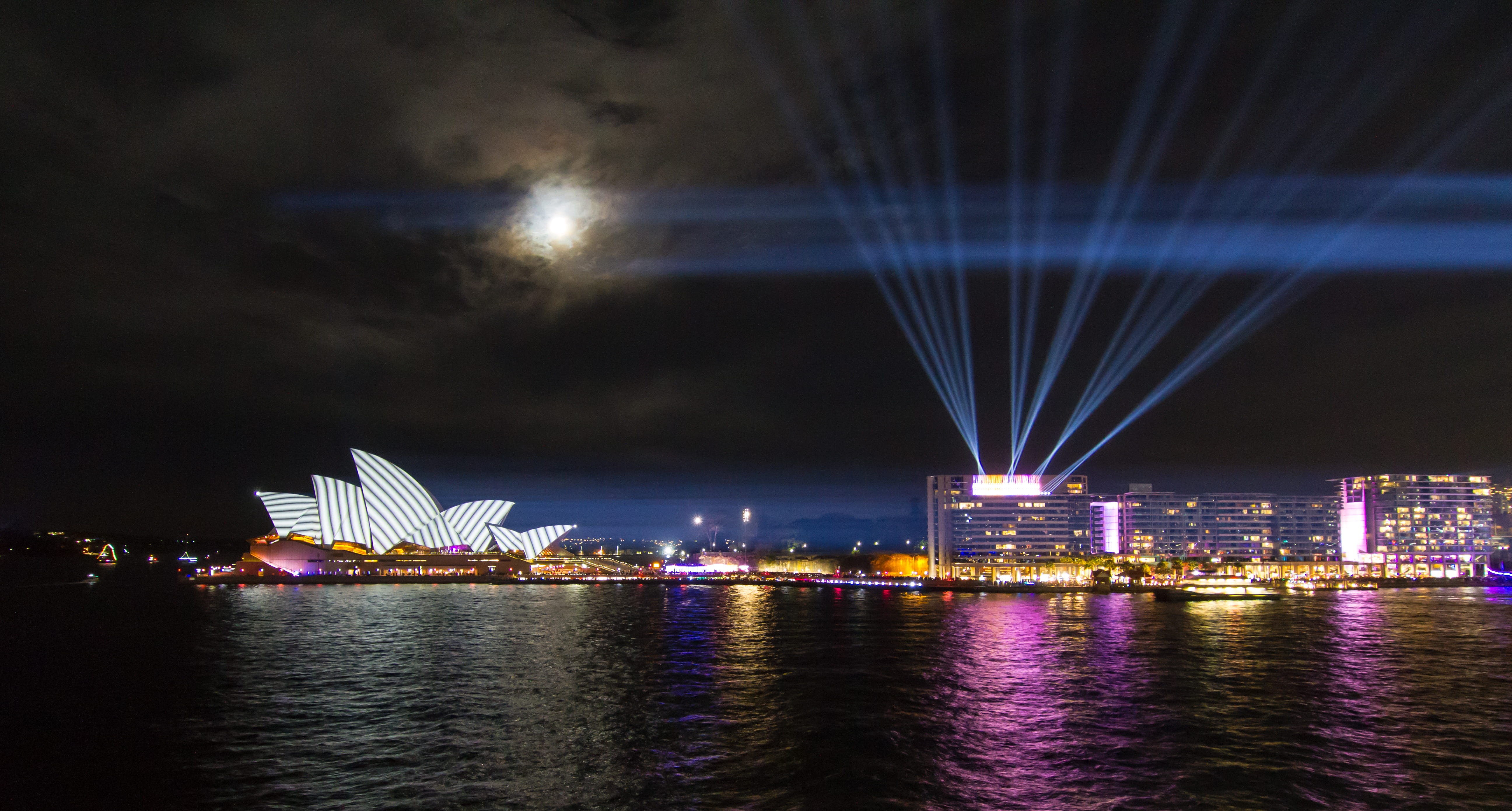 waterfront, laser, light ray, photoholgic, arts culture and entertainment, iconic landmark, moonlight, no people, architecture, cityscape, sky, outdoors, HD Wallpaper