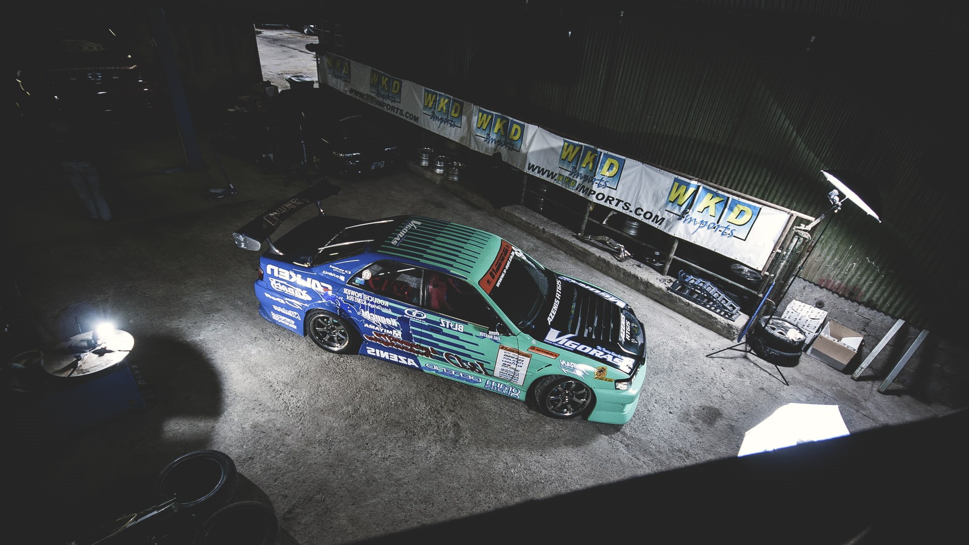 1080P, travel, rally, motor vehicle, car, chaser, green, city, mode of transportation, no people, drift, land vehicle, garage, road, blue, architecture, HD Wallpaper