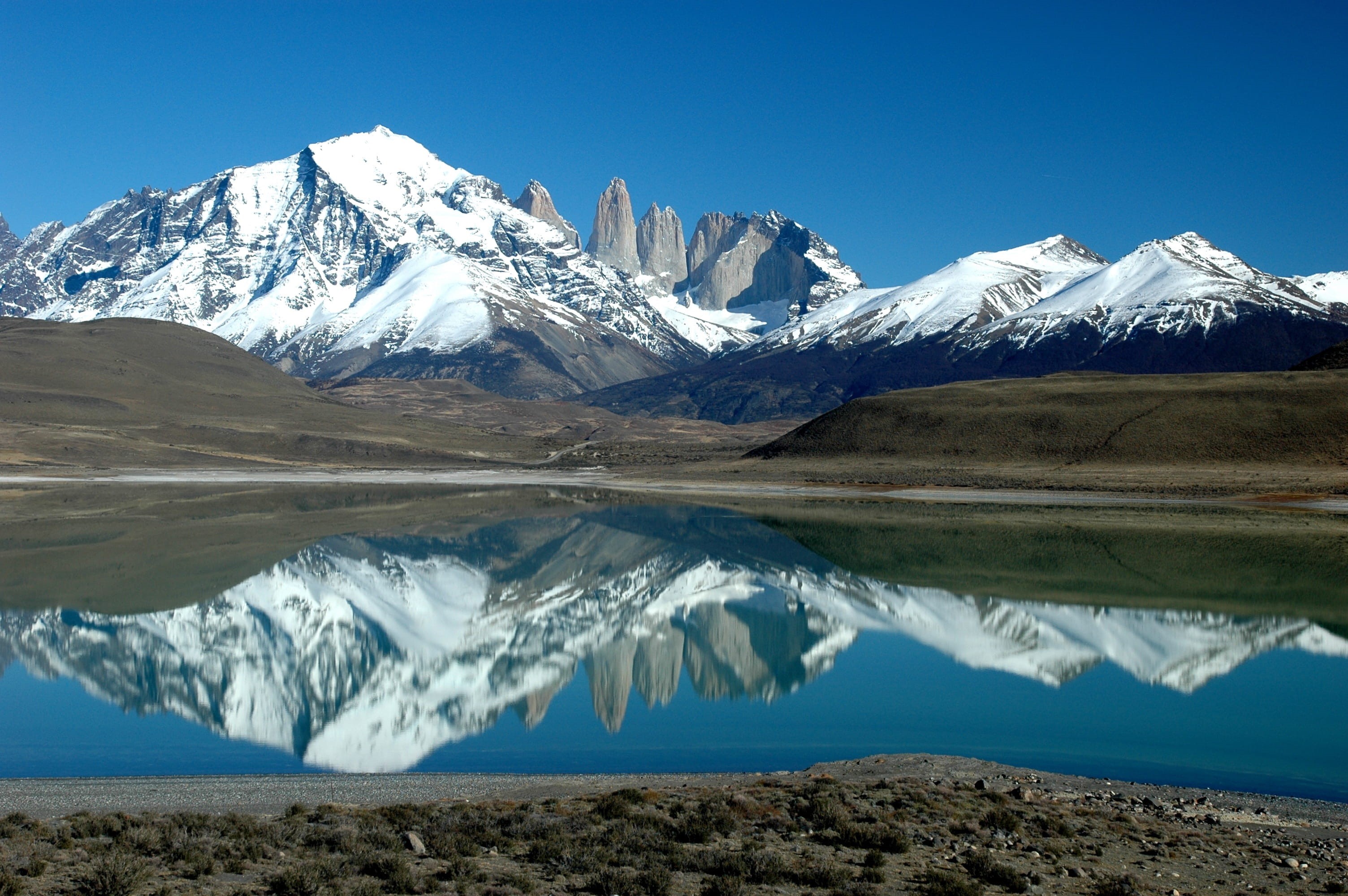 wilderness, reflection, lake, mountains, argentina, scenic, travel, beauty in nature, extreme Terrain, landscape, water, 2K, mountain, body, covered, near, HD Wallpaper