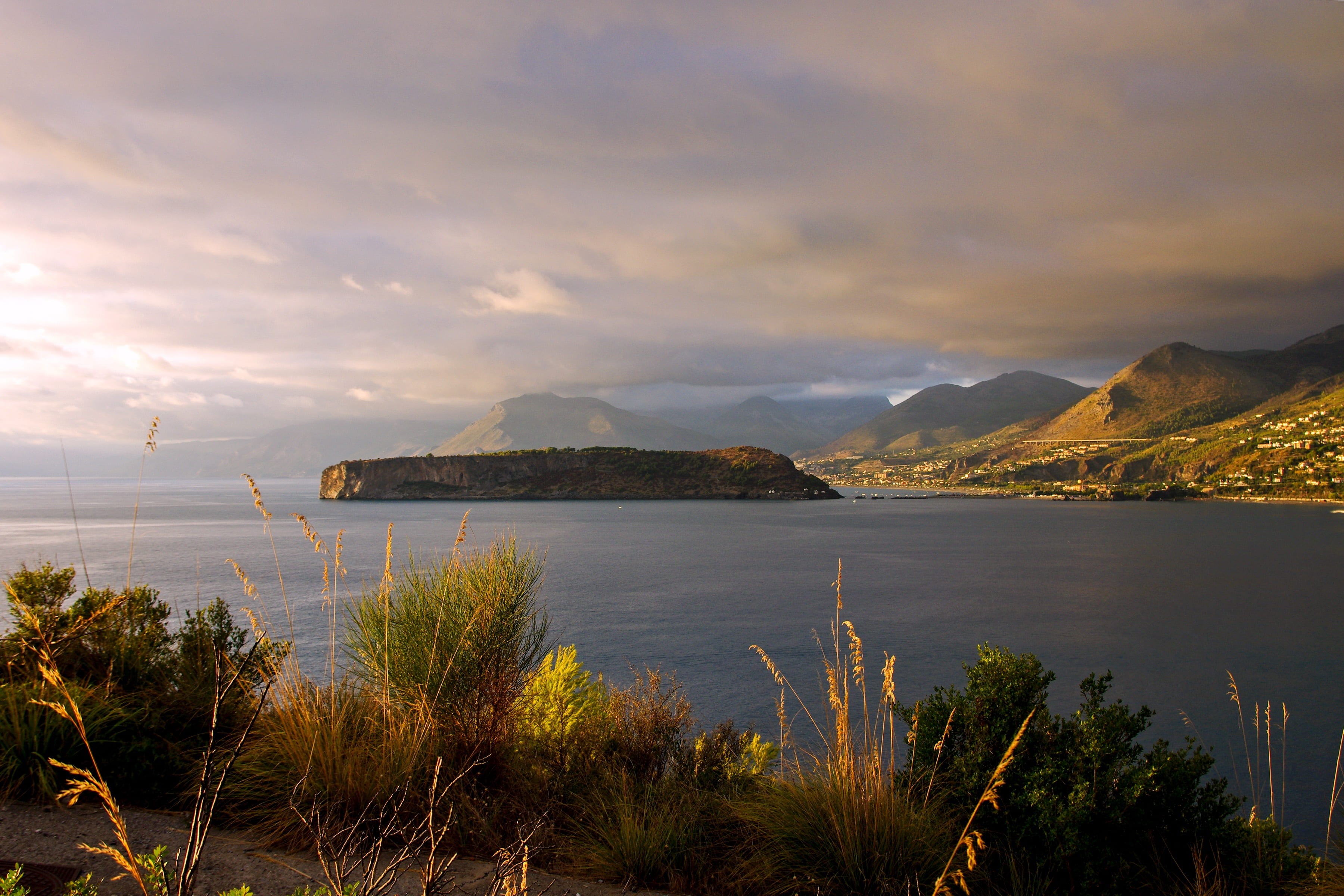 beauty in nature, landscape, clouds, plants, non-urban scene, praia a mare, sky, idyllic, sea, mountain peak, mountain range, island dino, tranquility, HD Wallpaper