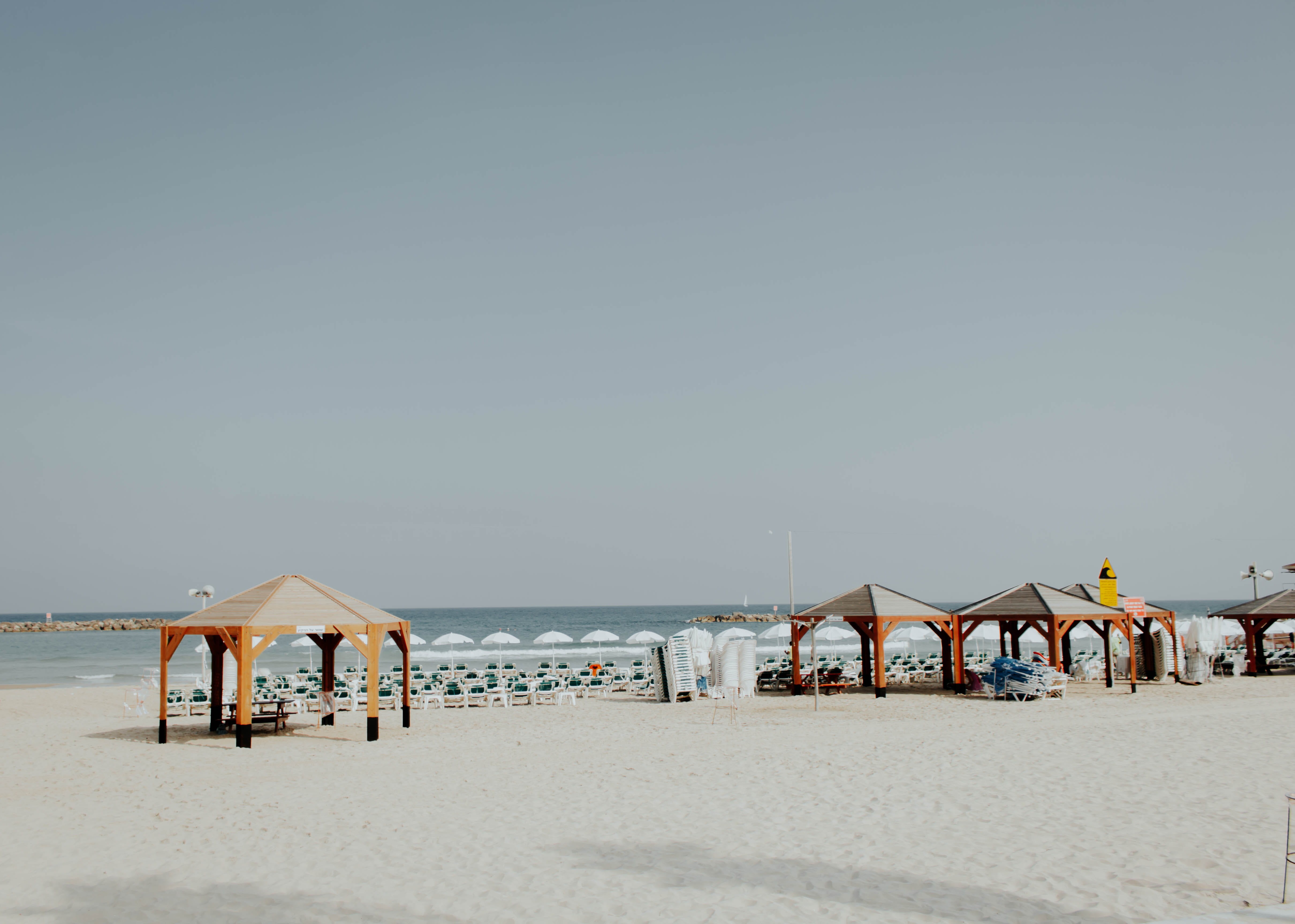 ocean, canopy, sun, clear sky, travel, near, shelter, beauty in nature, holiday, rural, israel, sand beach, sky, horizon, water, hut, outdoors, 4K, tranquility, HD Wallpaper