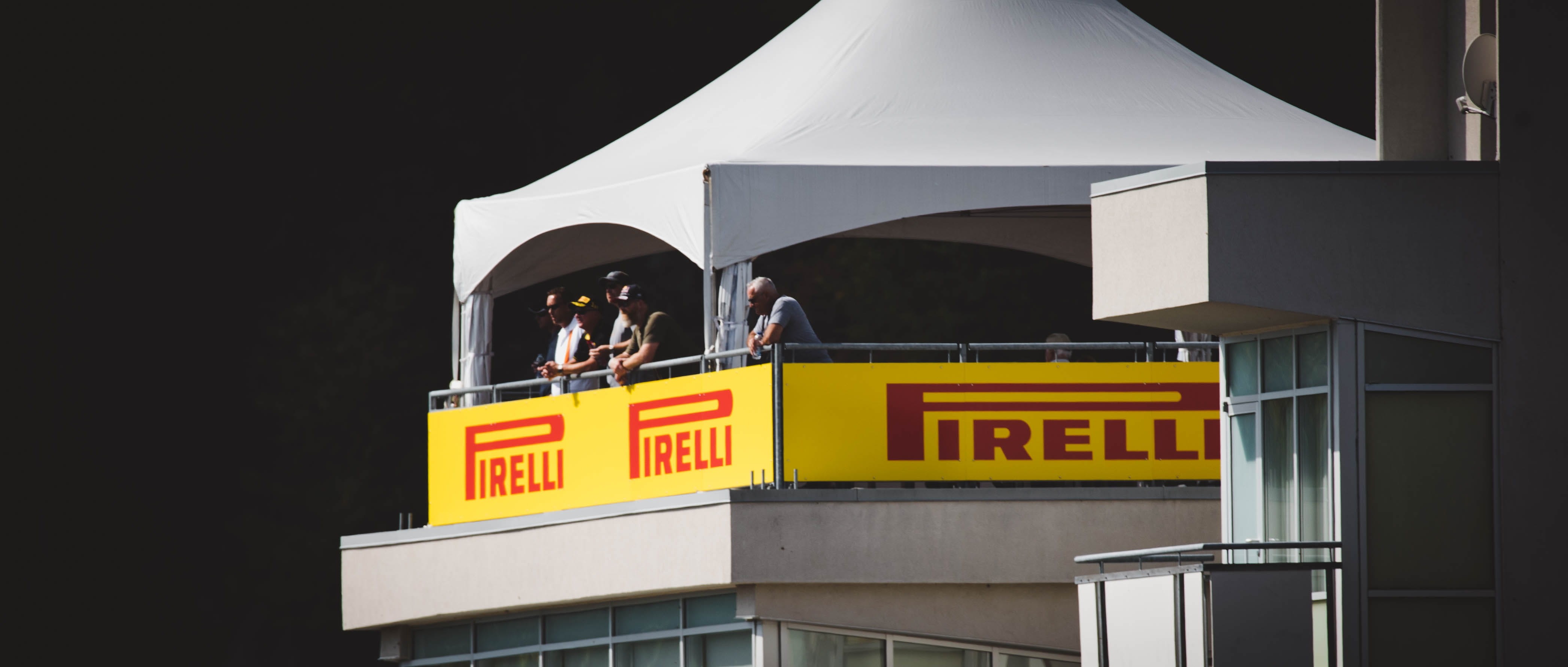 retail, two people, capital letter, building exterior, western script, watchtower, racetrack, 4K, watch, built structure, architecture, pirelli, commercial sign, HD Wallpaper