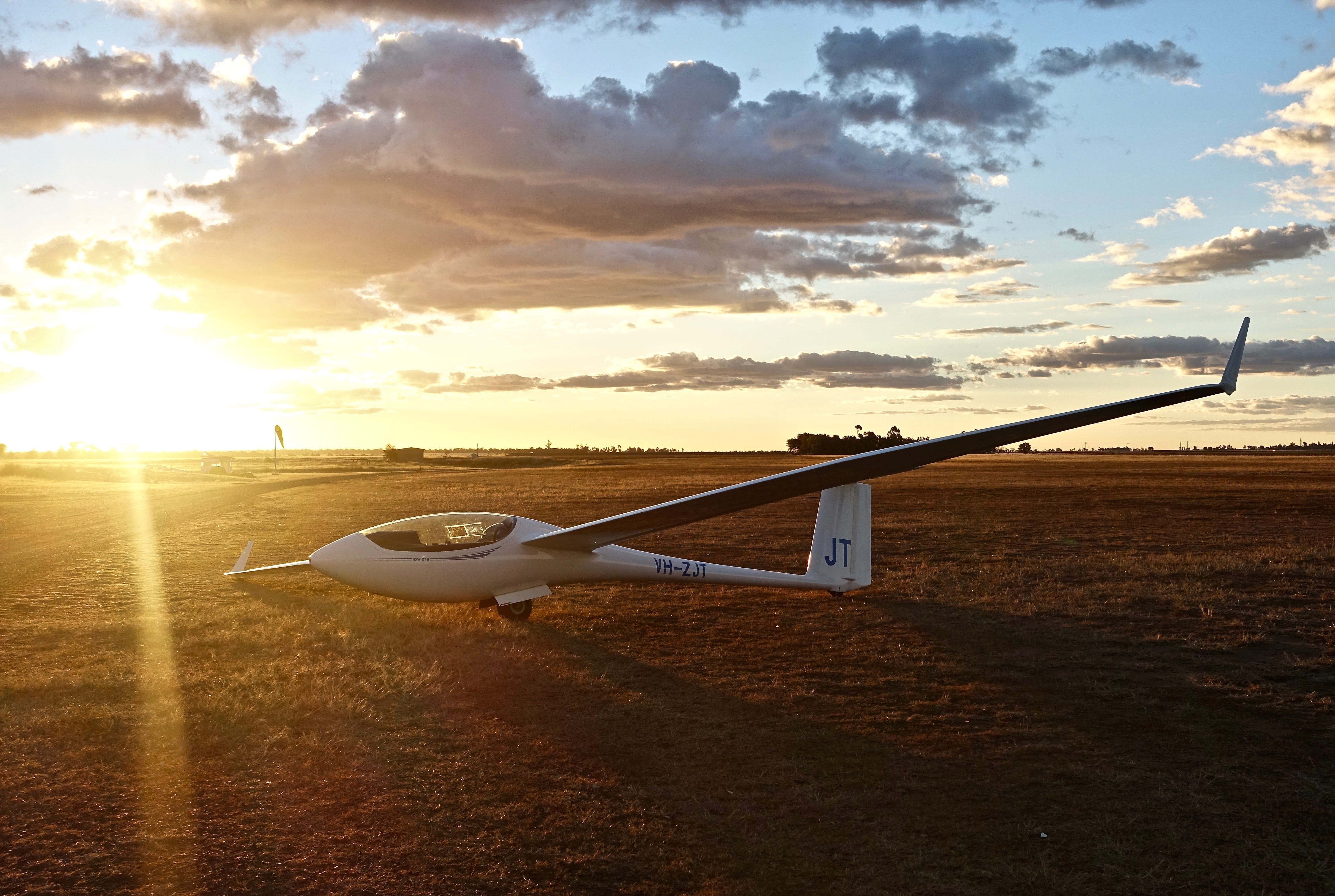 transportation, outdoors, orange color, Glider, no people, sunlight, Aircraft, beauty in nature, Sunset, sun, sunbeam, land, cloud - sky, Fun, dom, sport, HD Wallpaper