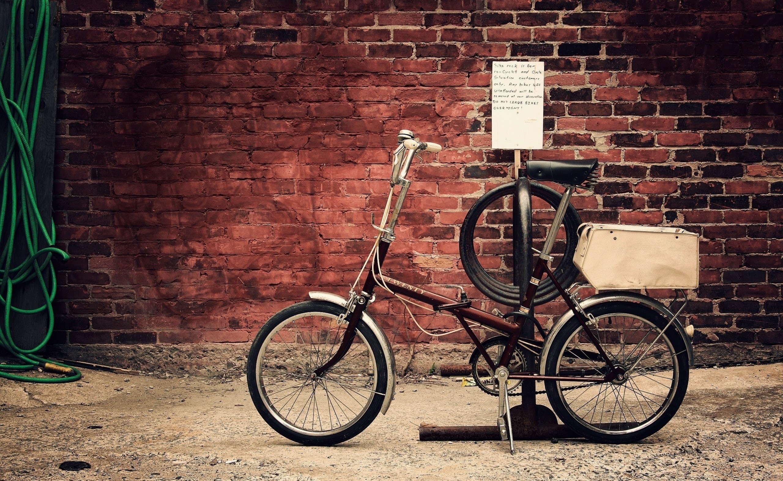 building exterior, black, brick wall, bike, footpath, wheel, no people, land vehicle, mode of transportation, building, Urban, wall, wall - building feature, HD Wallpaper