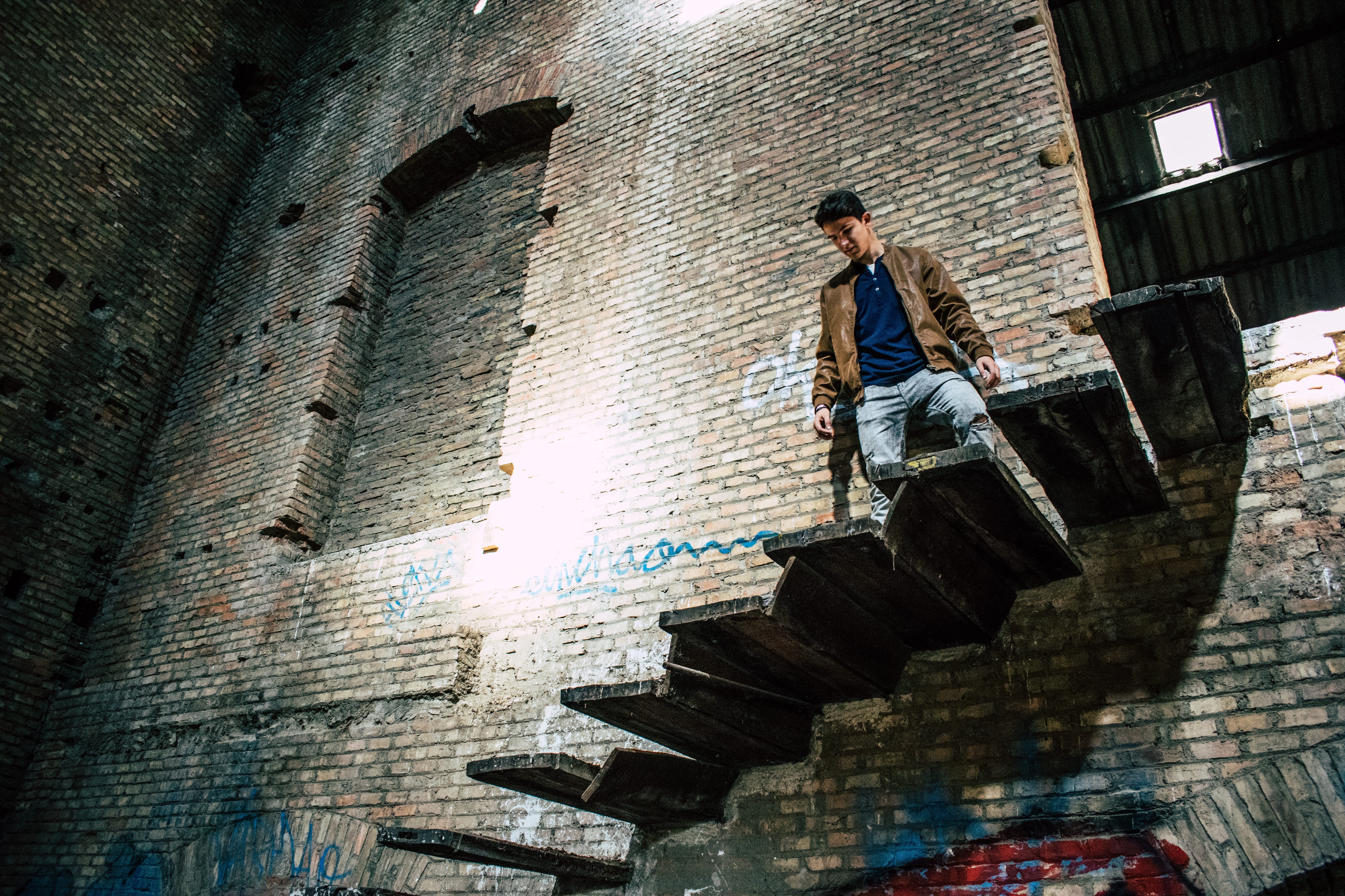 real people, wall, men, lifestyles, 5K, ruins, wall - building feature, young adult, leisure activity, clothes, casual clothing, one person, low angle view, HD Wallpaper