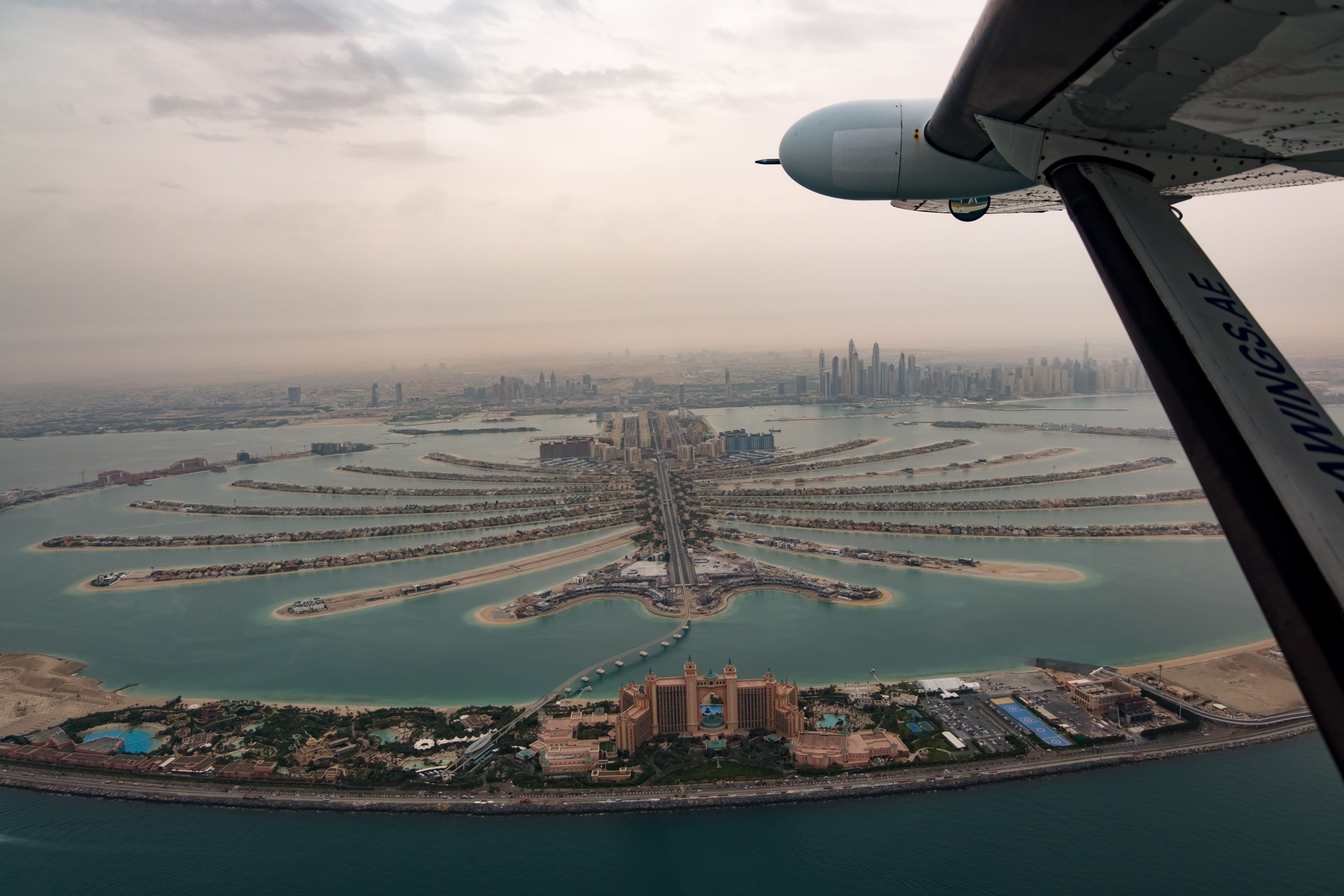 air vehicle, outdoors, cityscape, transportation, plane, dubai, mode of transportation, travel destinations, travel, water, city, palm jumeirah, skyscraper, HD Wallpaper