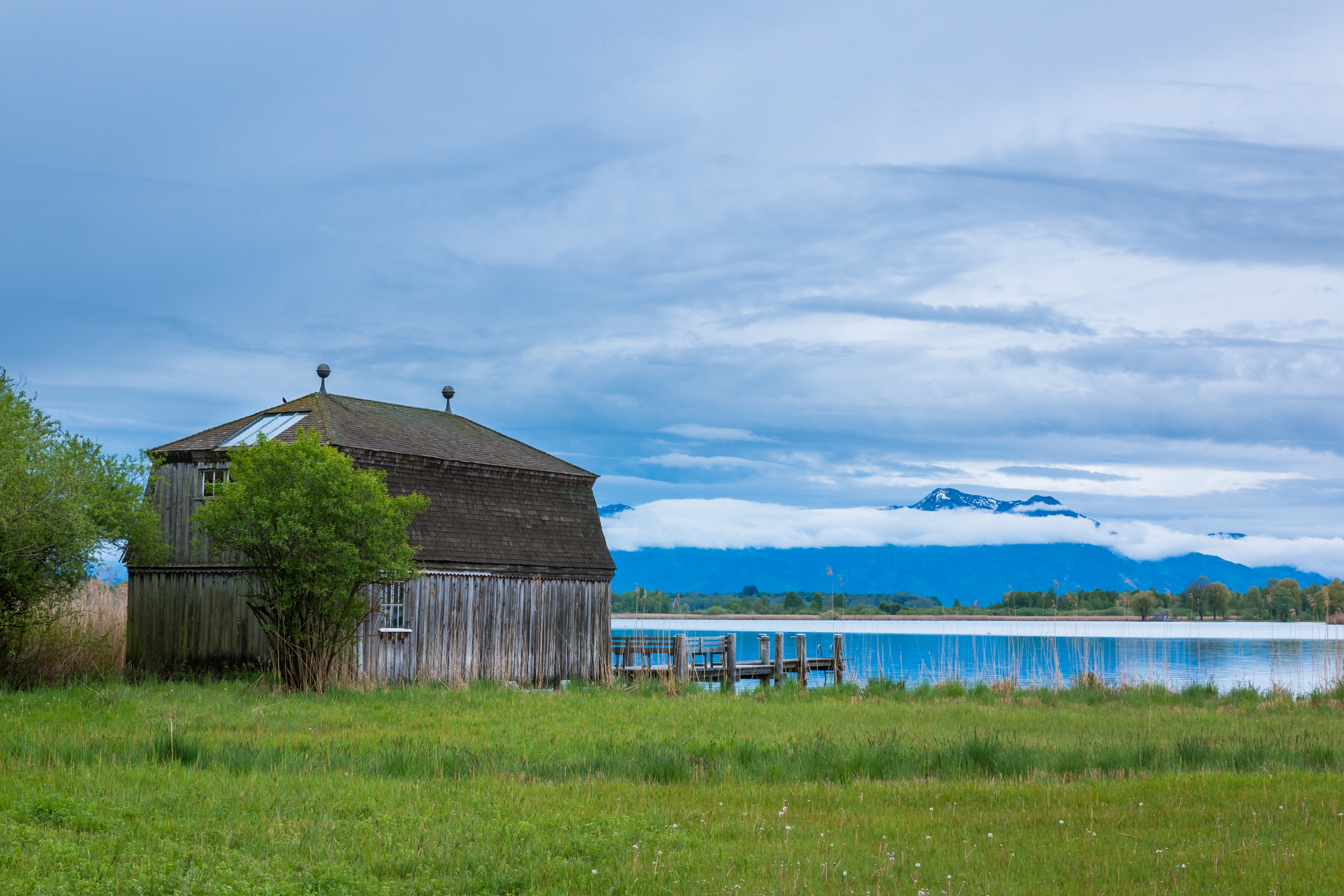 grass, web, scenics - nature, vacation, cloud - sky, hut, log cabin, built structure, water, 5K, beside, mountains, sky, alpine, building exterior, no people, HD Wallpaper