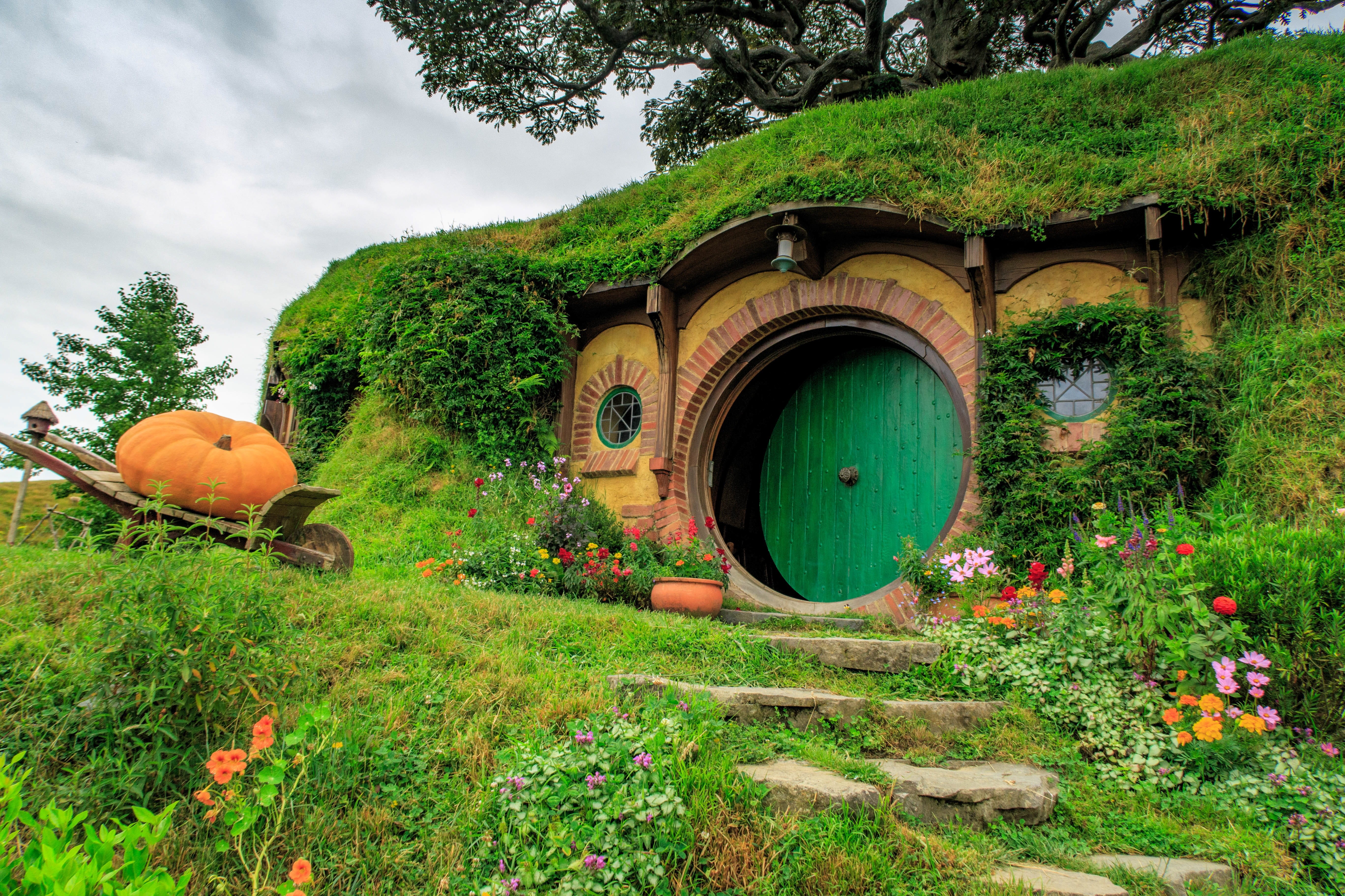 wheel, nature, field, summer, day, tree, no people, built structure, travel, grass, land, beauty in nature, sky, outdoors, hobbit, architecture, hobbiton, HD Wallpaper
