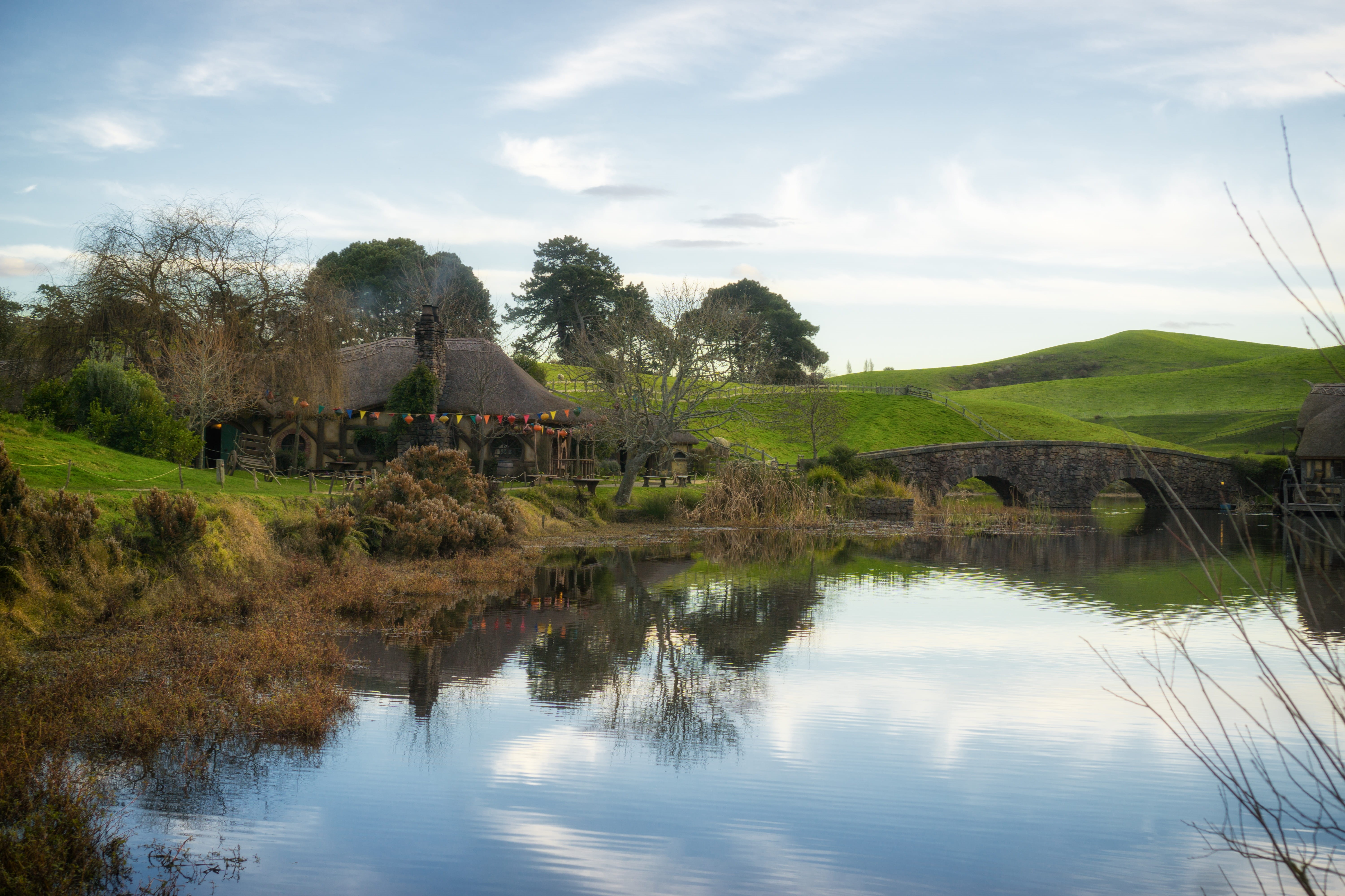 beauty in nature, bridge, cloud - sky, water, nature, 5K, trees, plant, nz, day, non-urban scene, sky, hobbiton, tranquil scene, tree, tranquility, no people, HD Wallpaper