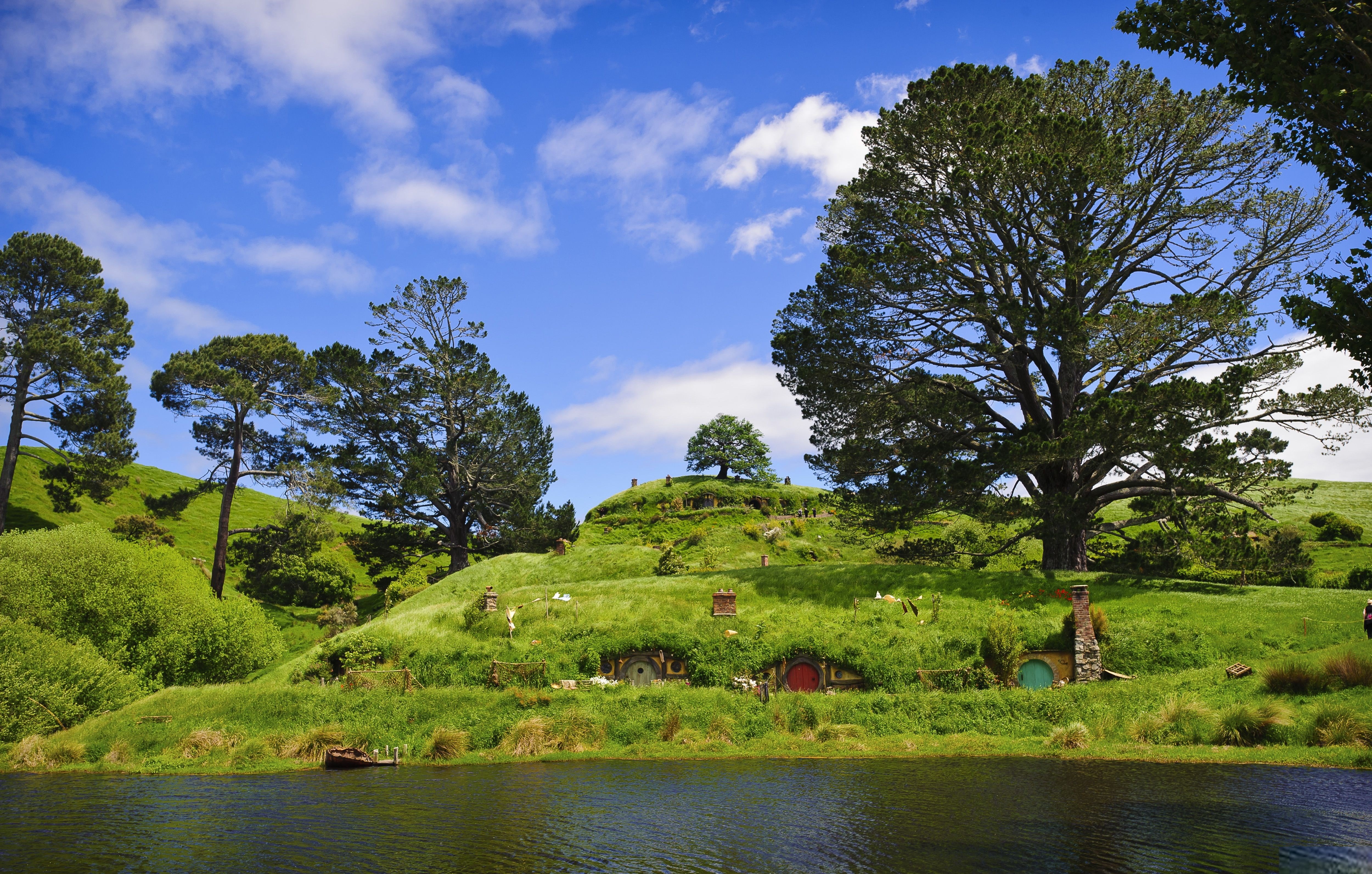 non-urban scene, beauty in nature, outdoors, lake, plant, tranquil scene, cloud - sky, tree, land, nature, growth, scenics - nature, green color, hobbiton, HD Wallpaper